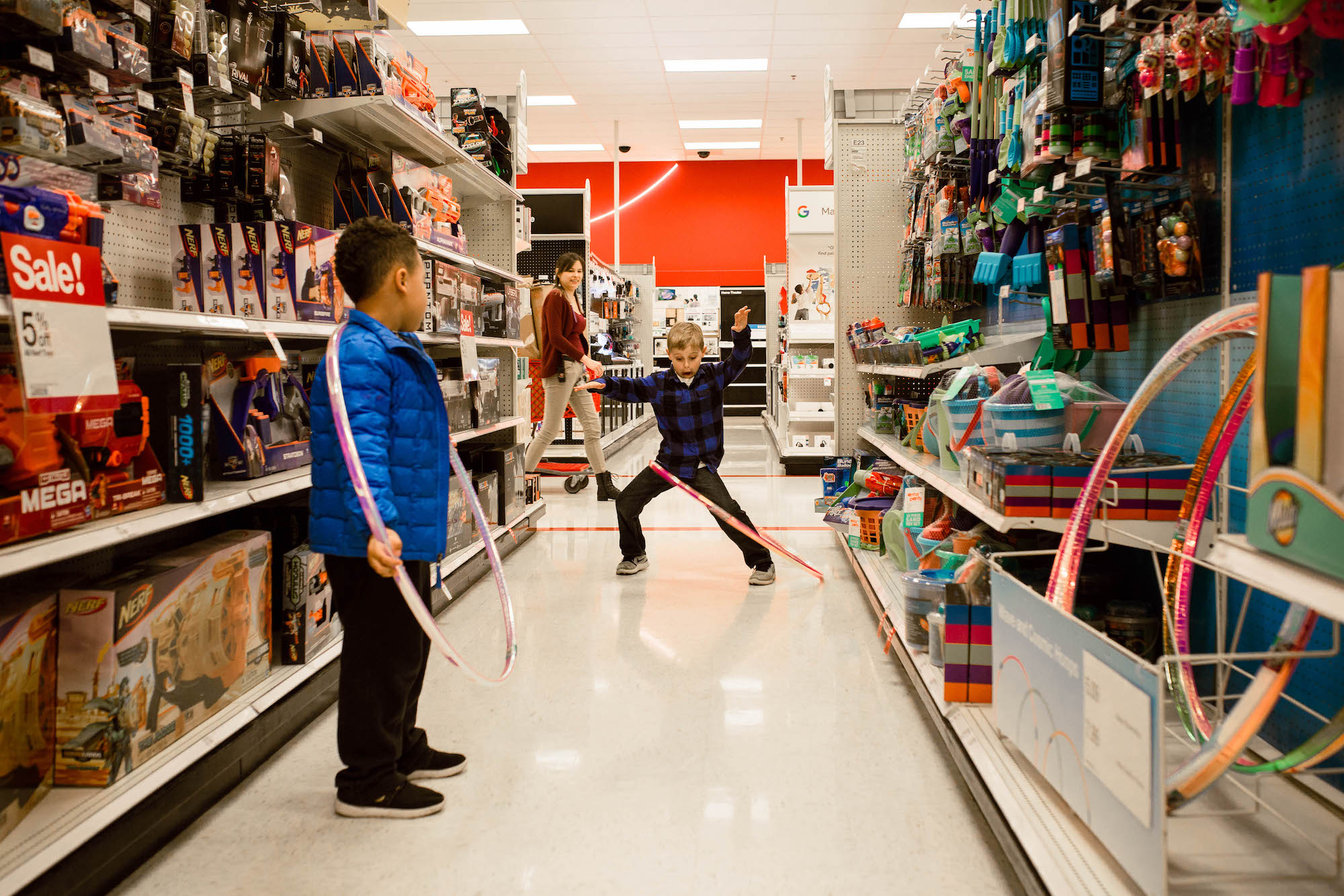 boys goof off in store - documentary family photography