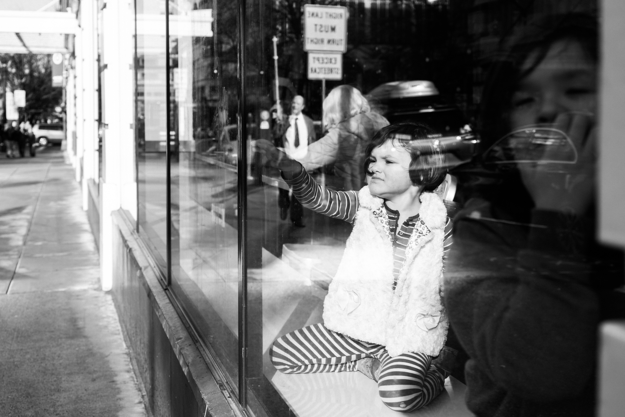 girl as seen through window - documentary family photography