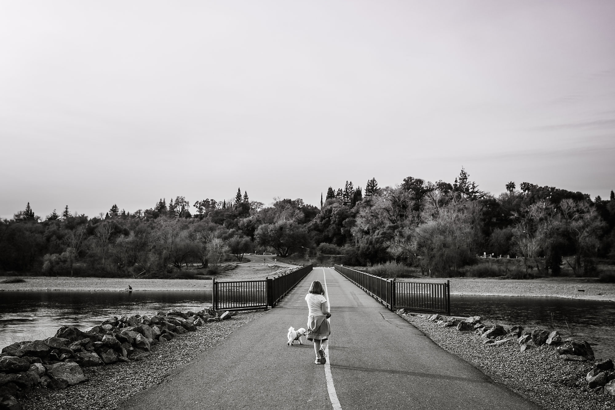 girl running down road - documentary family photography