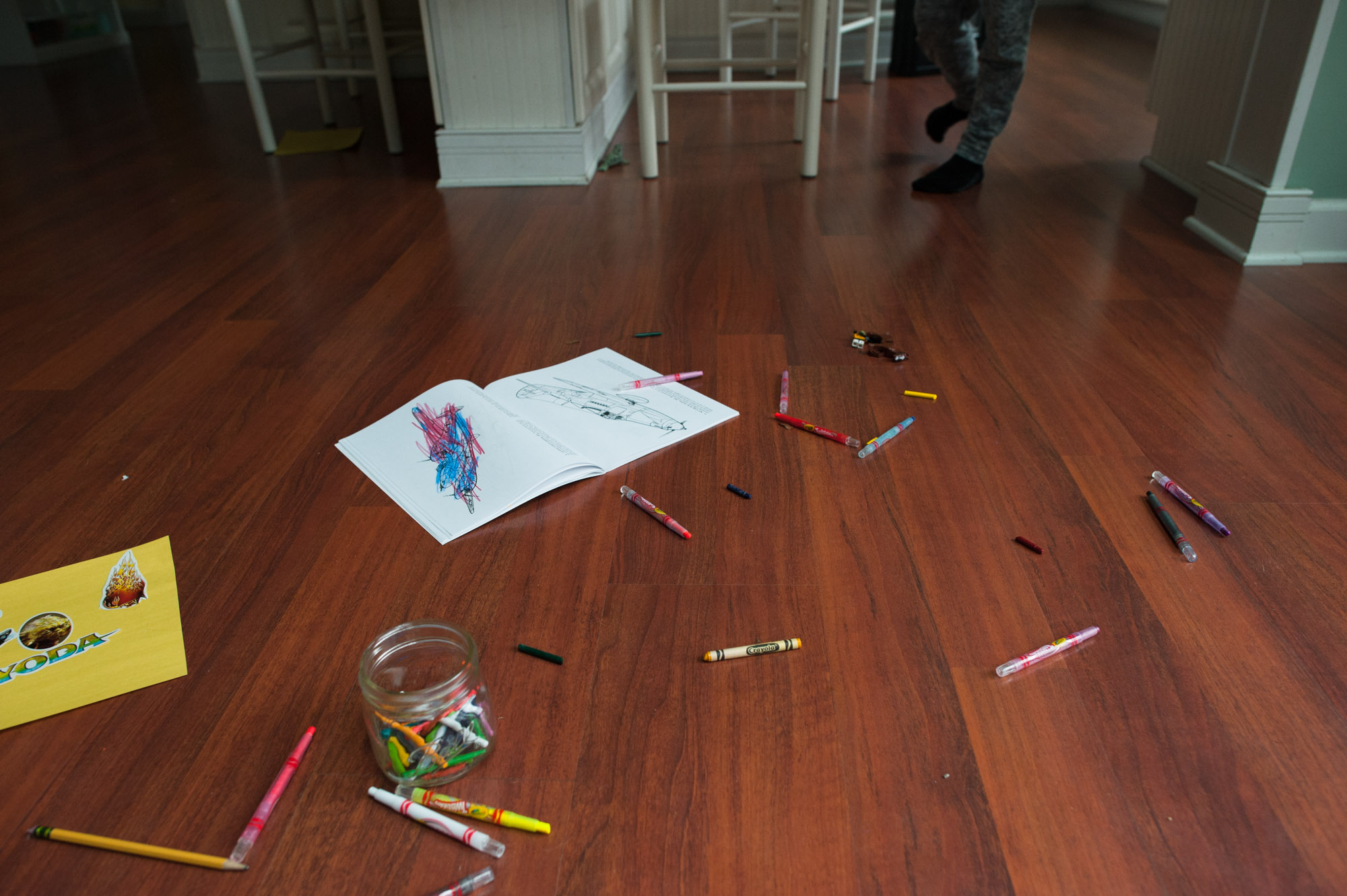 crayons spread across floor - documentary family photography