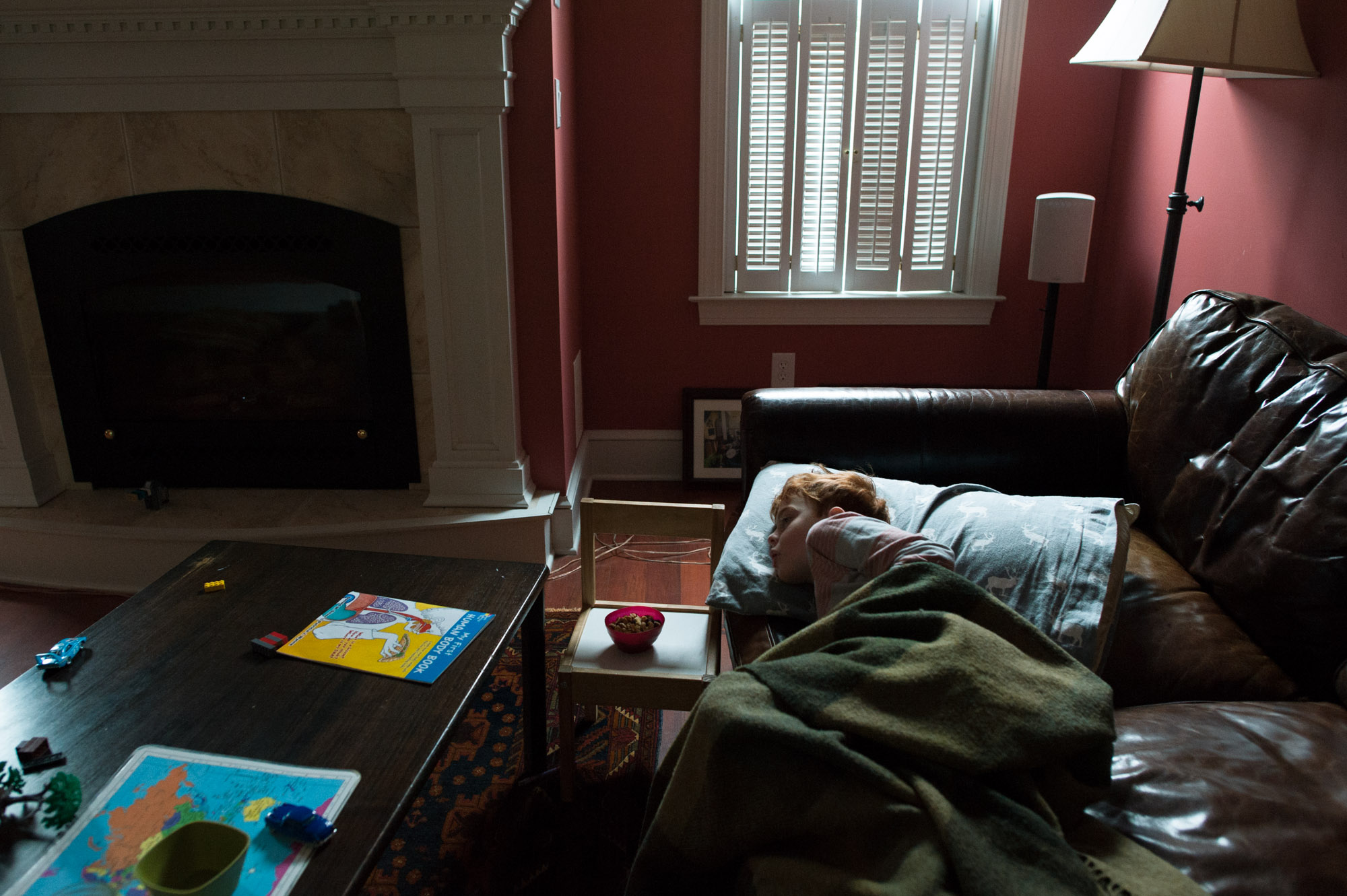 boy lying on couch - Documentary Family Photography