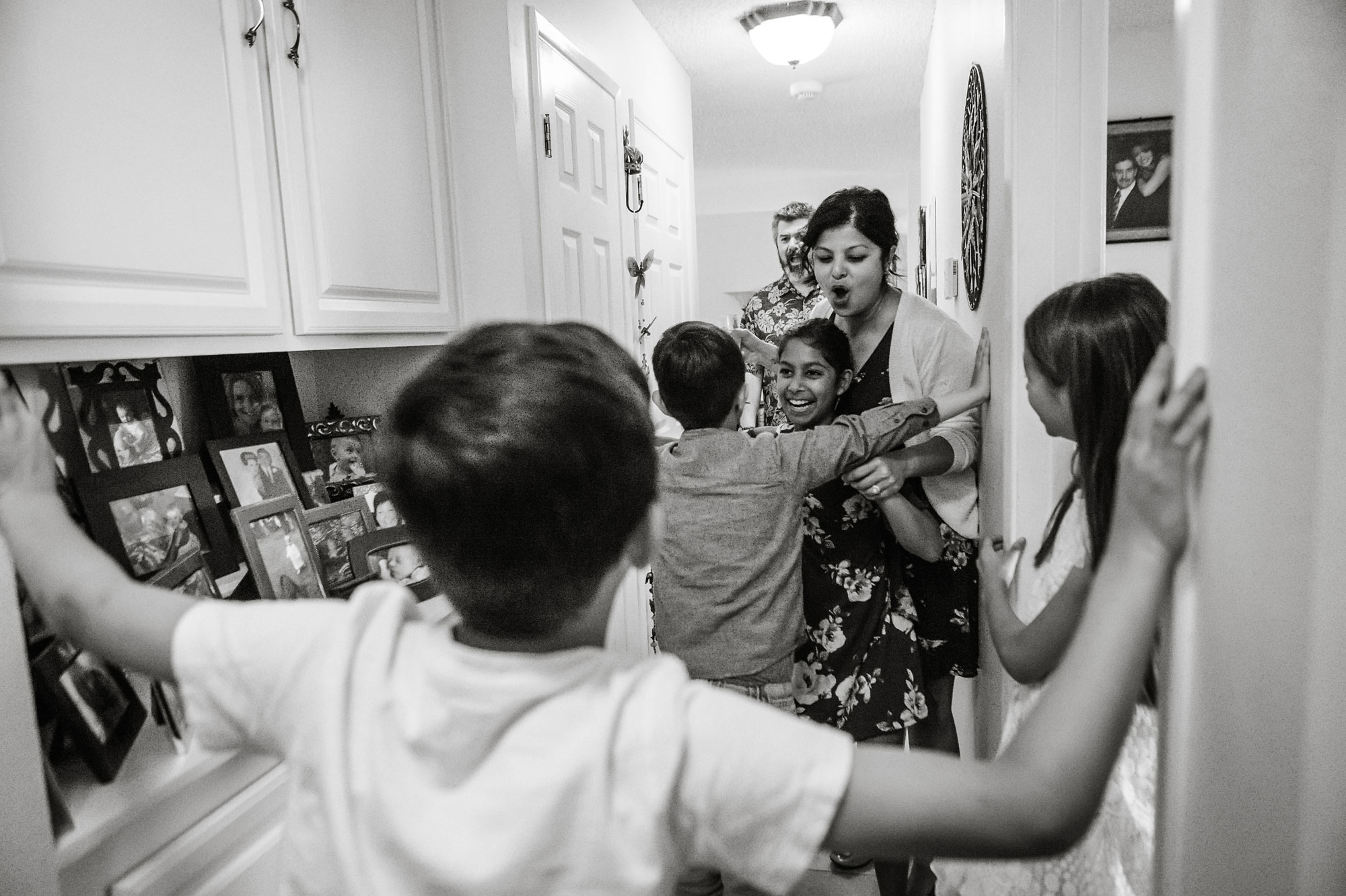 giving hugs at arrival - Documentary Family Photography