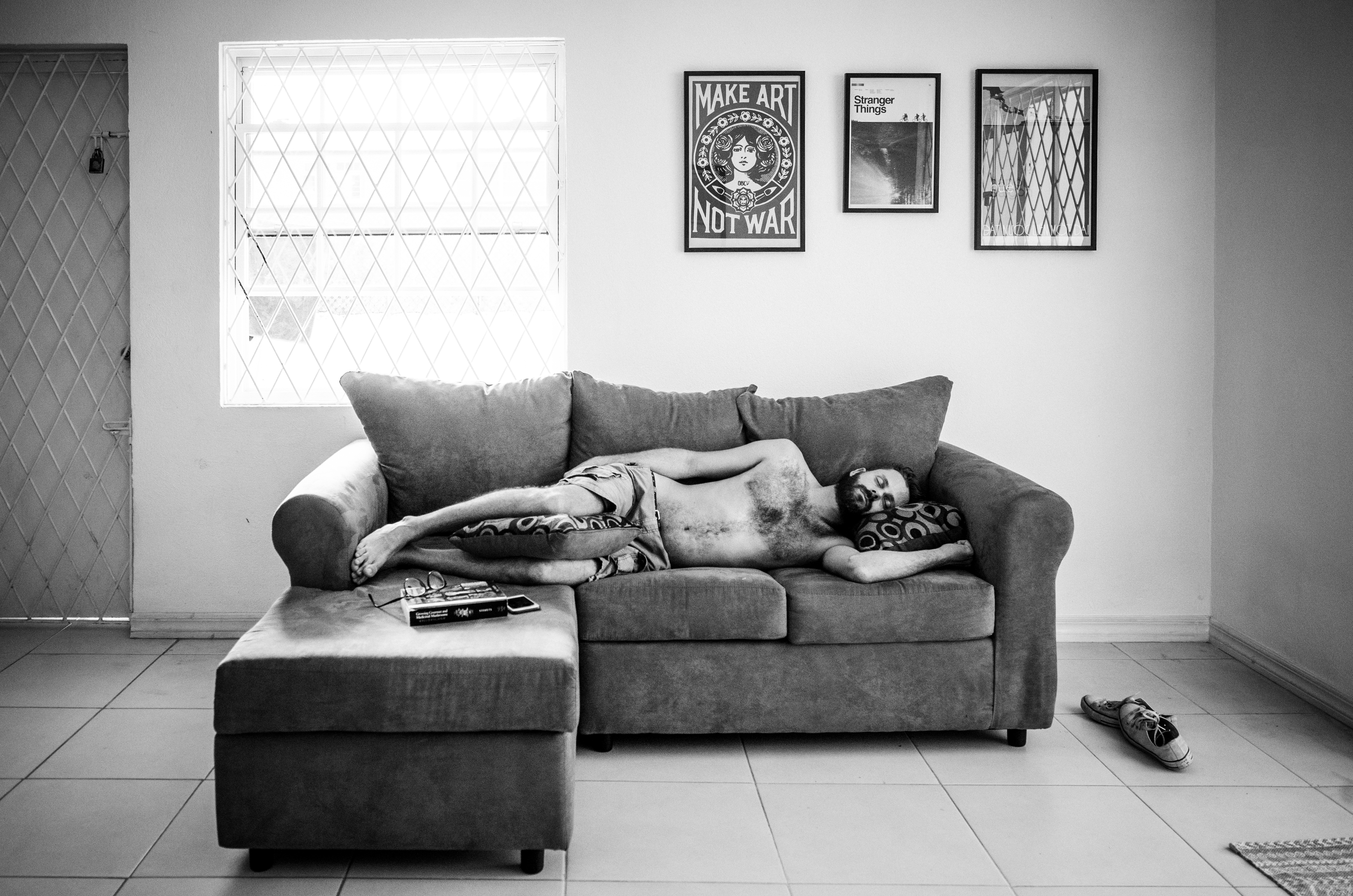 man asleep on couch - Documentary Family Photography