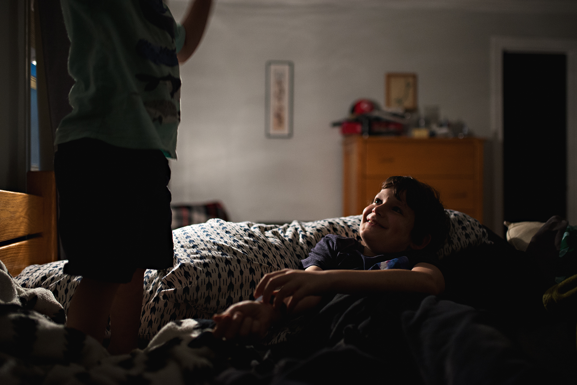 boys laughing in dark - documentary family photography