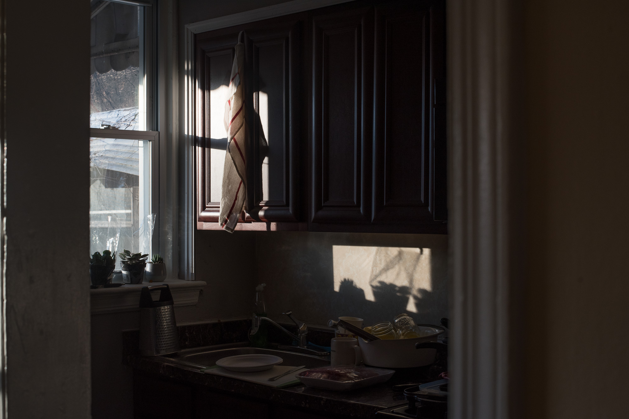 light through window with wrapped curtain - documentary family photography