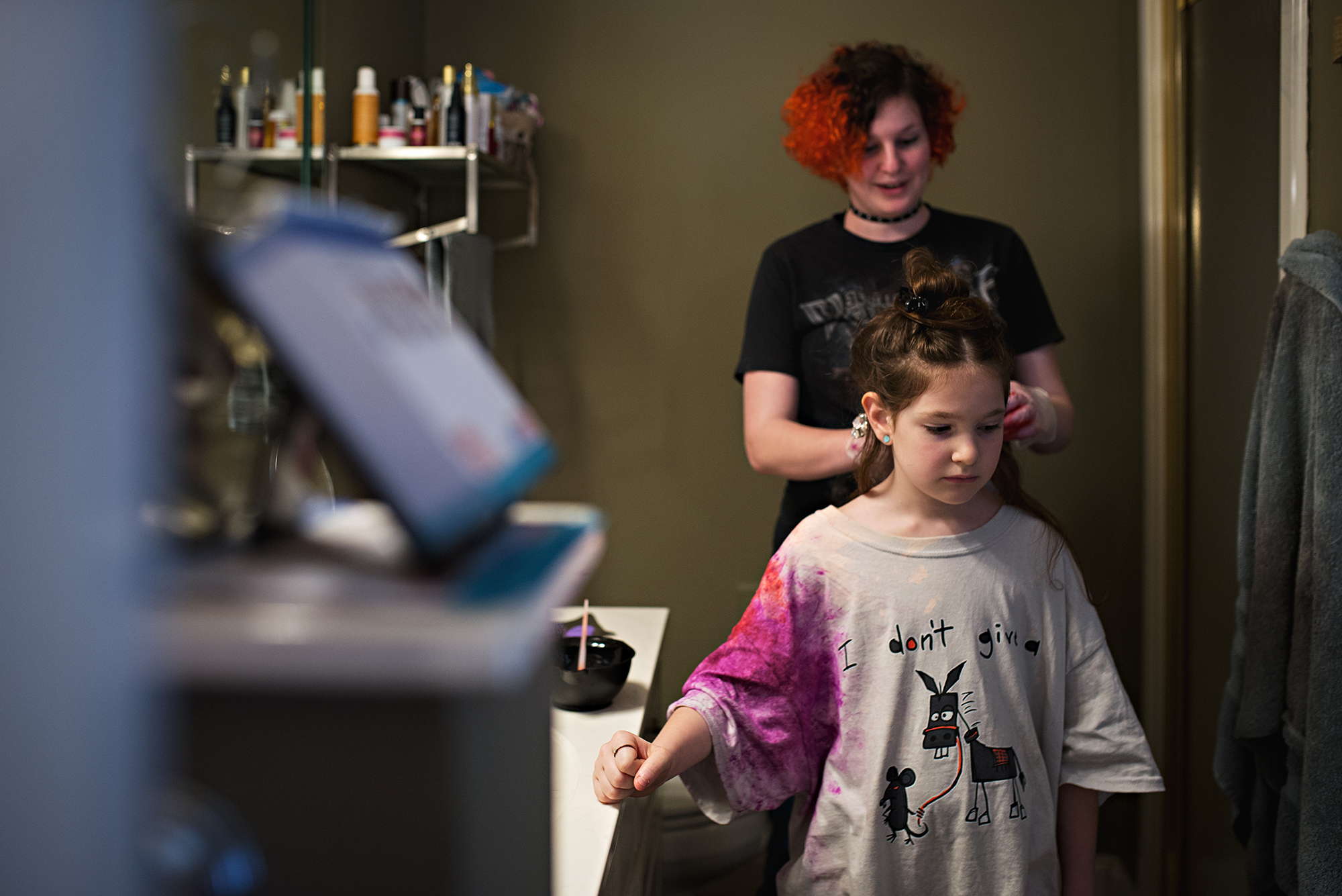 big sister doing little sister's hair - documentary family photography