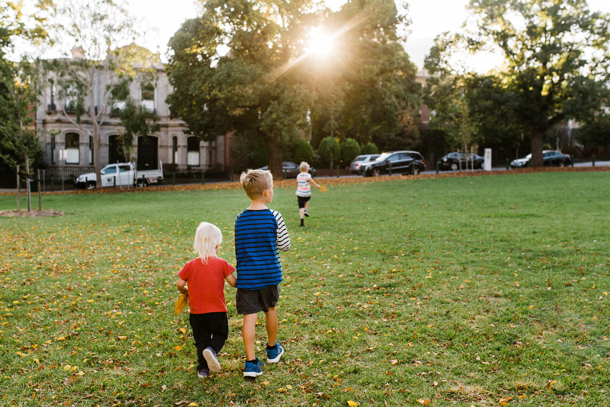 kids running across field - documentary family photography