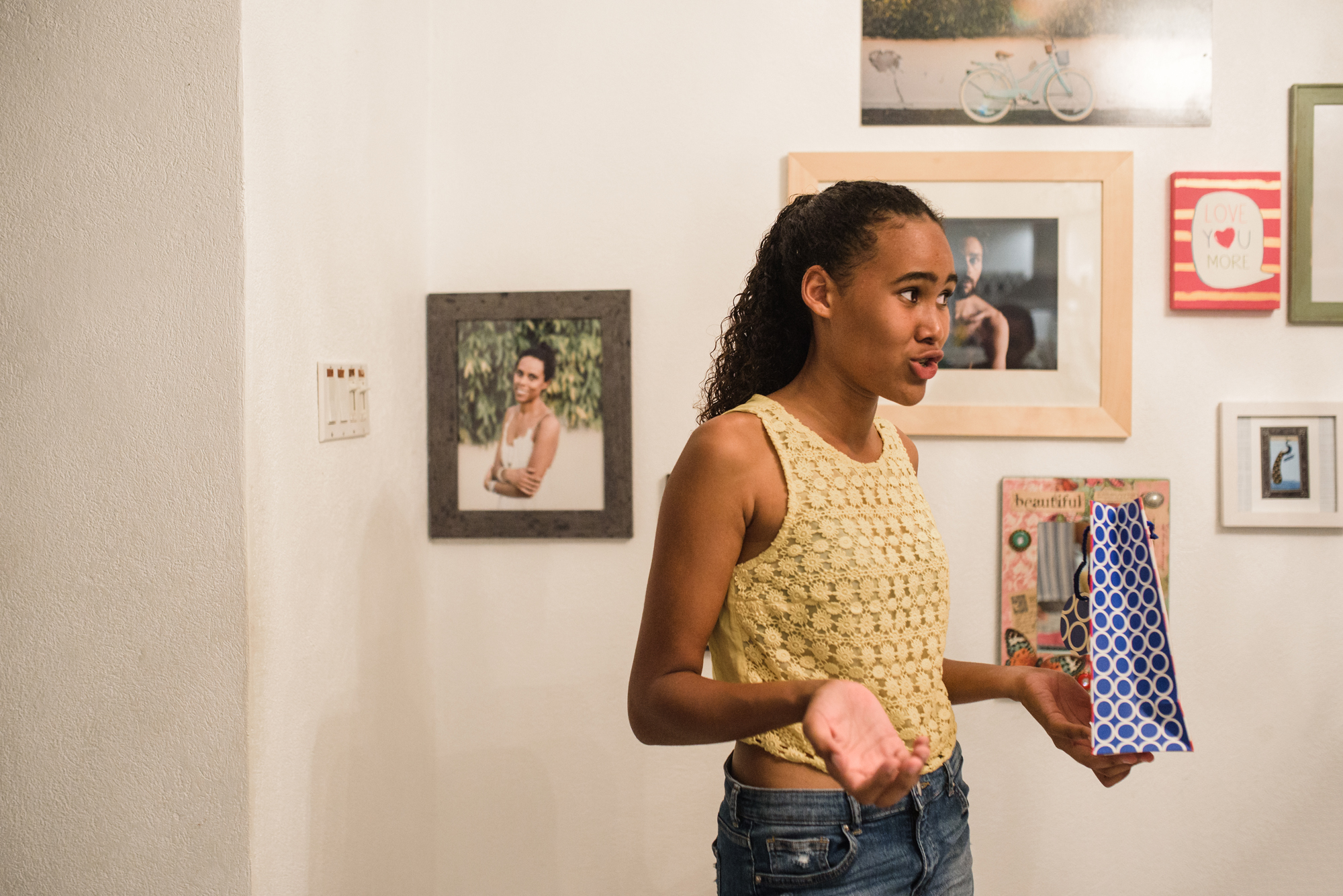 girl conversing dramatically - documentary family photography