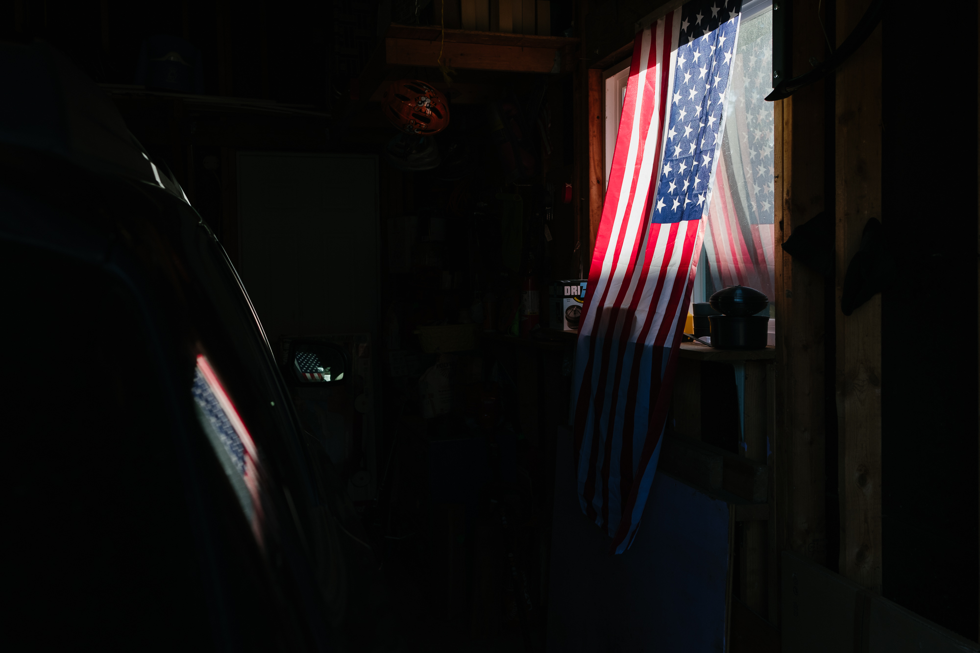 flag in garage window - documentary family photography