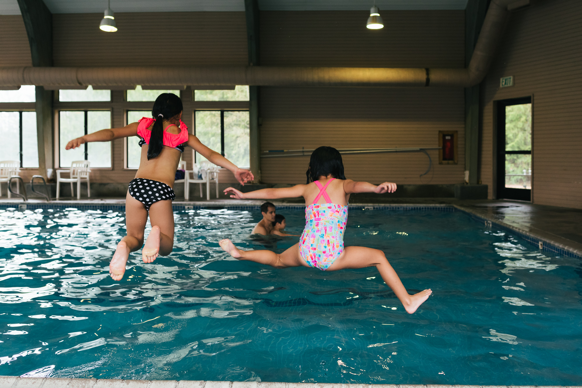 kids jumping into pool - documentary family photography