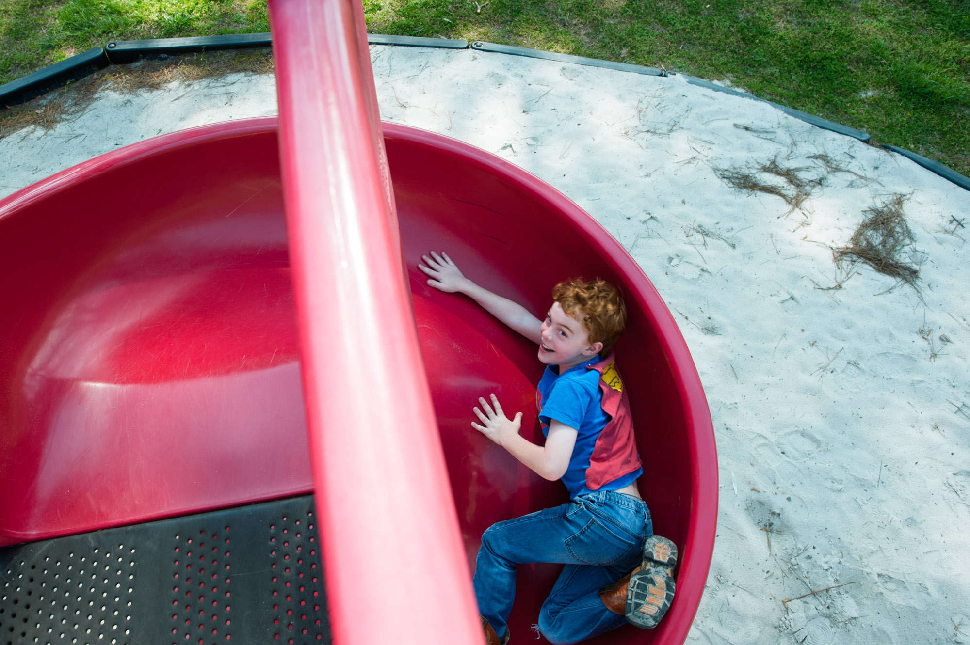 boy on slide - documentary family photography