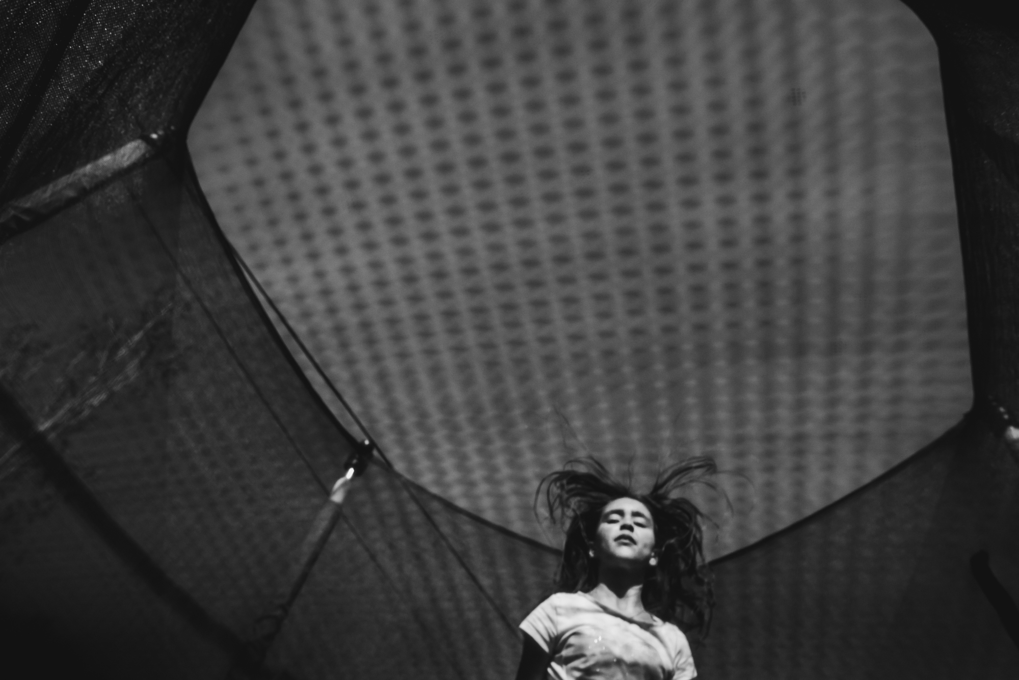 girl on trampoline - documentary family photography