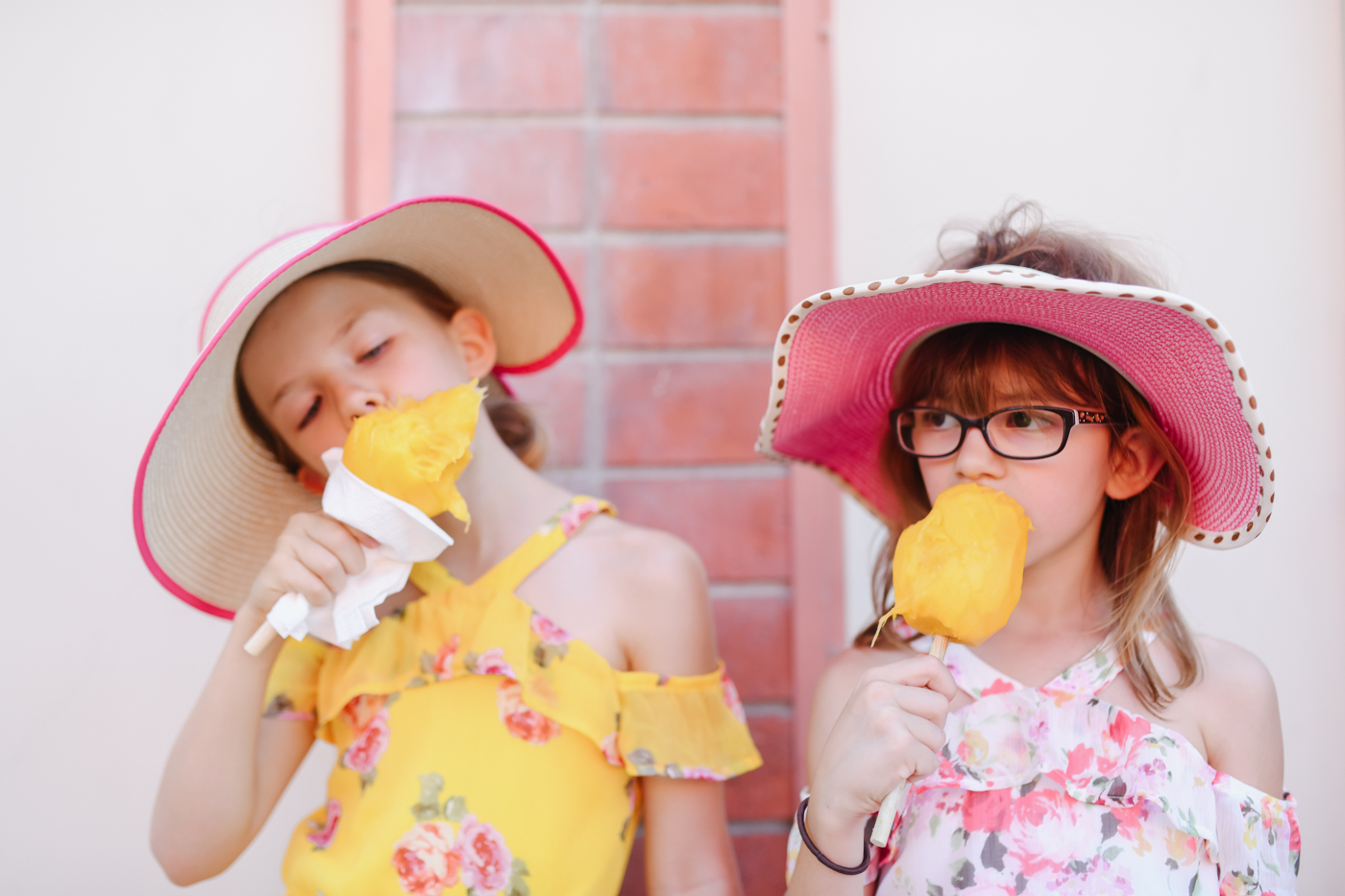 girls in hats eat ice cream - documentary family photography