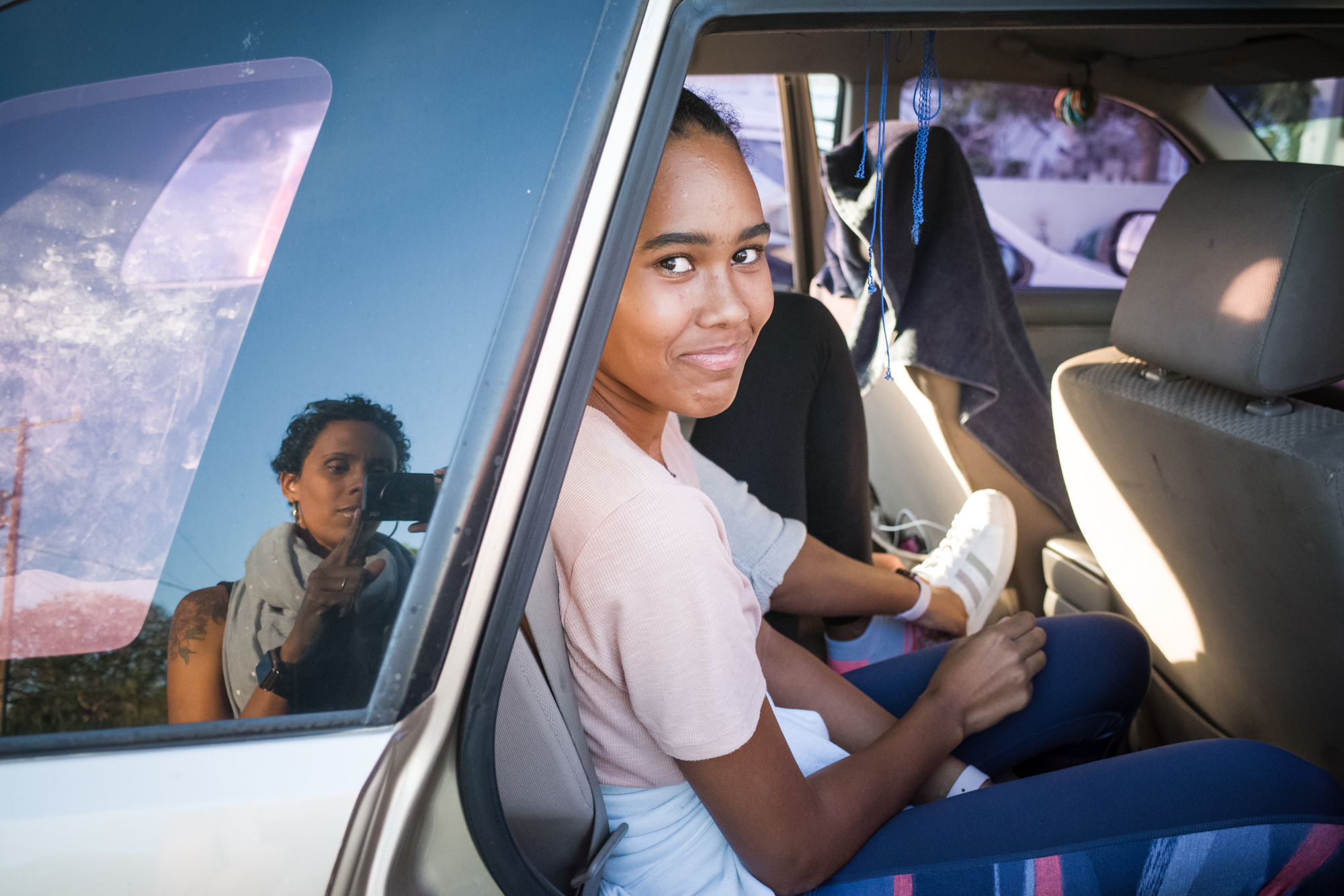 girl in backseat of car - documentary family photography