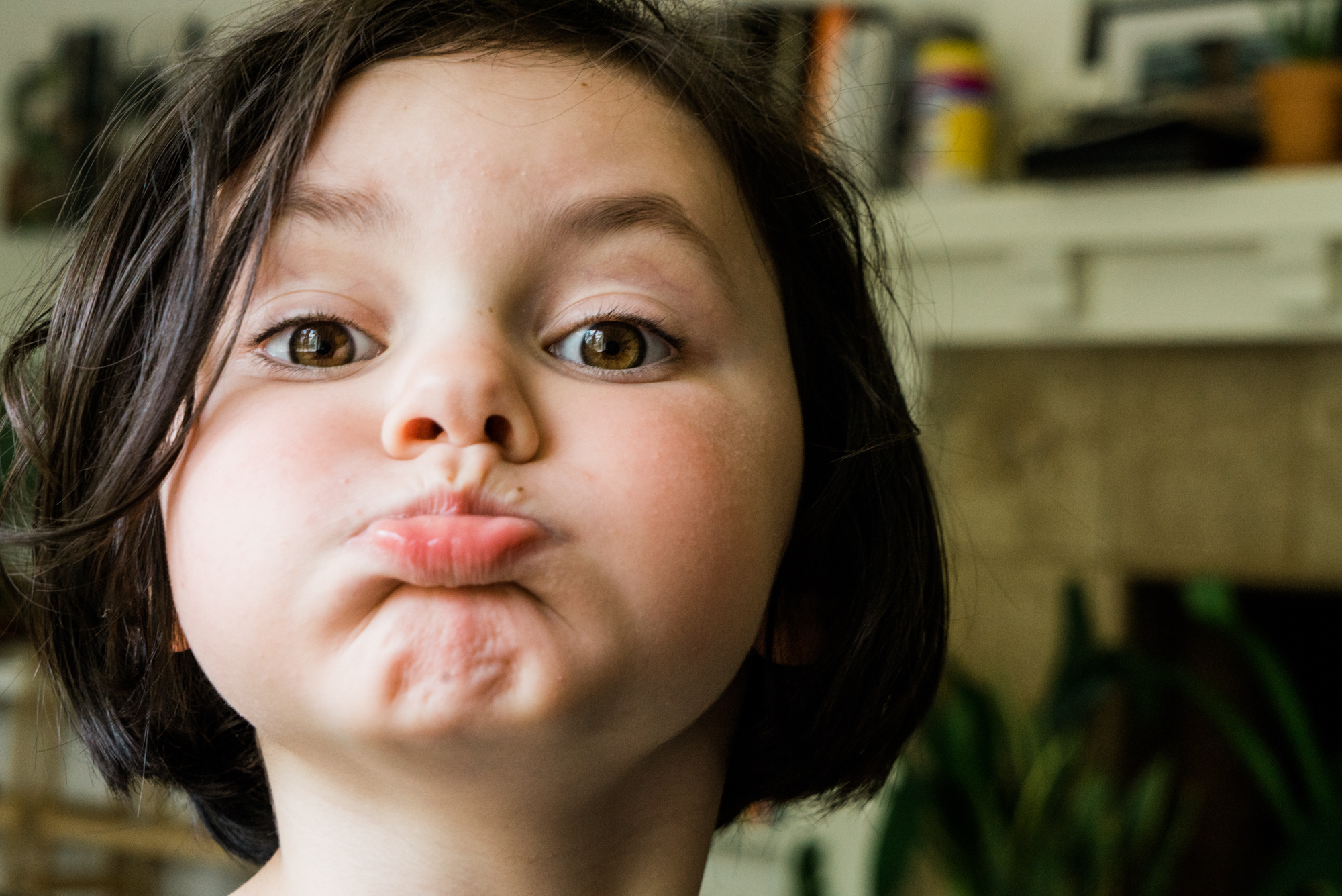 girl making face at camera - documentary family photography