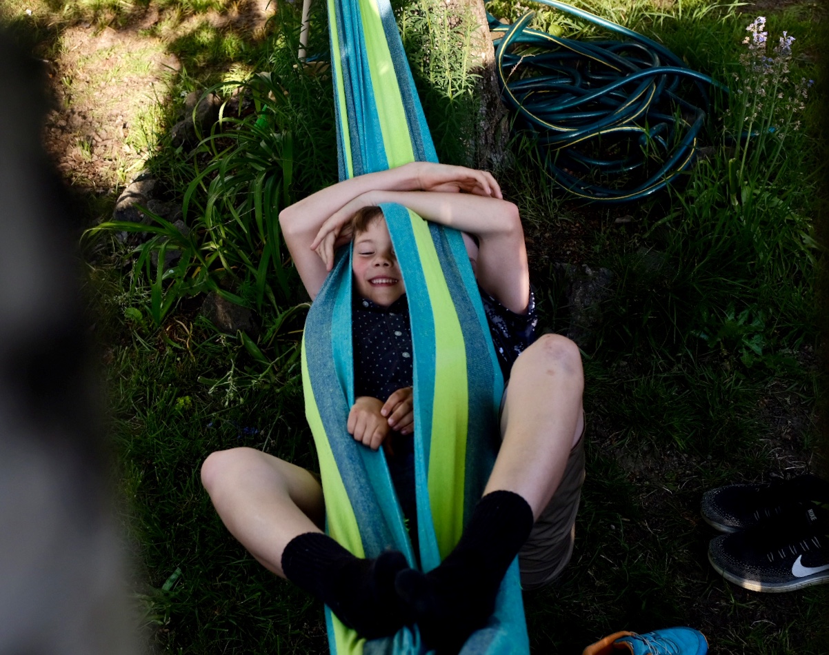 boy wrapped in hammock
