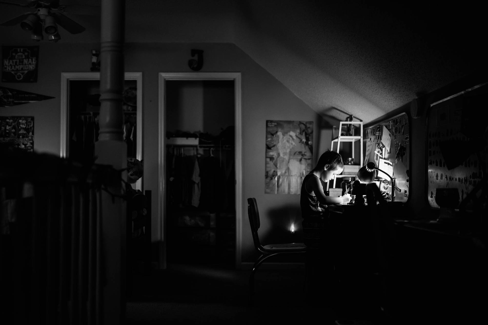 boy works at desk late at night - Documentary Family Photography