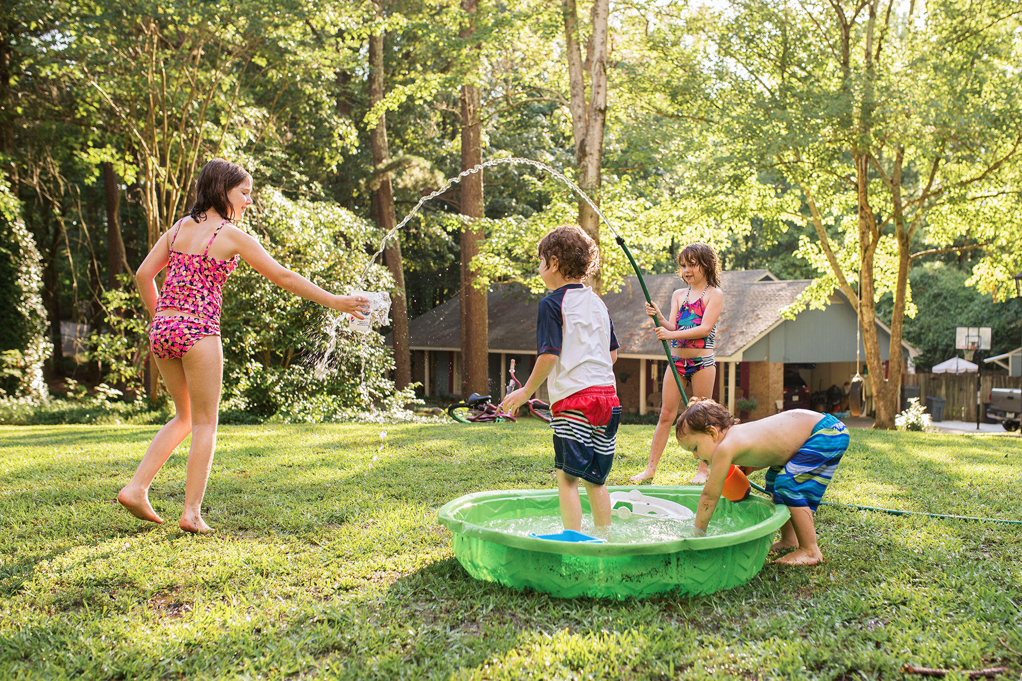 kids playing in wading pool - Documentary Family Photography