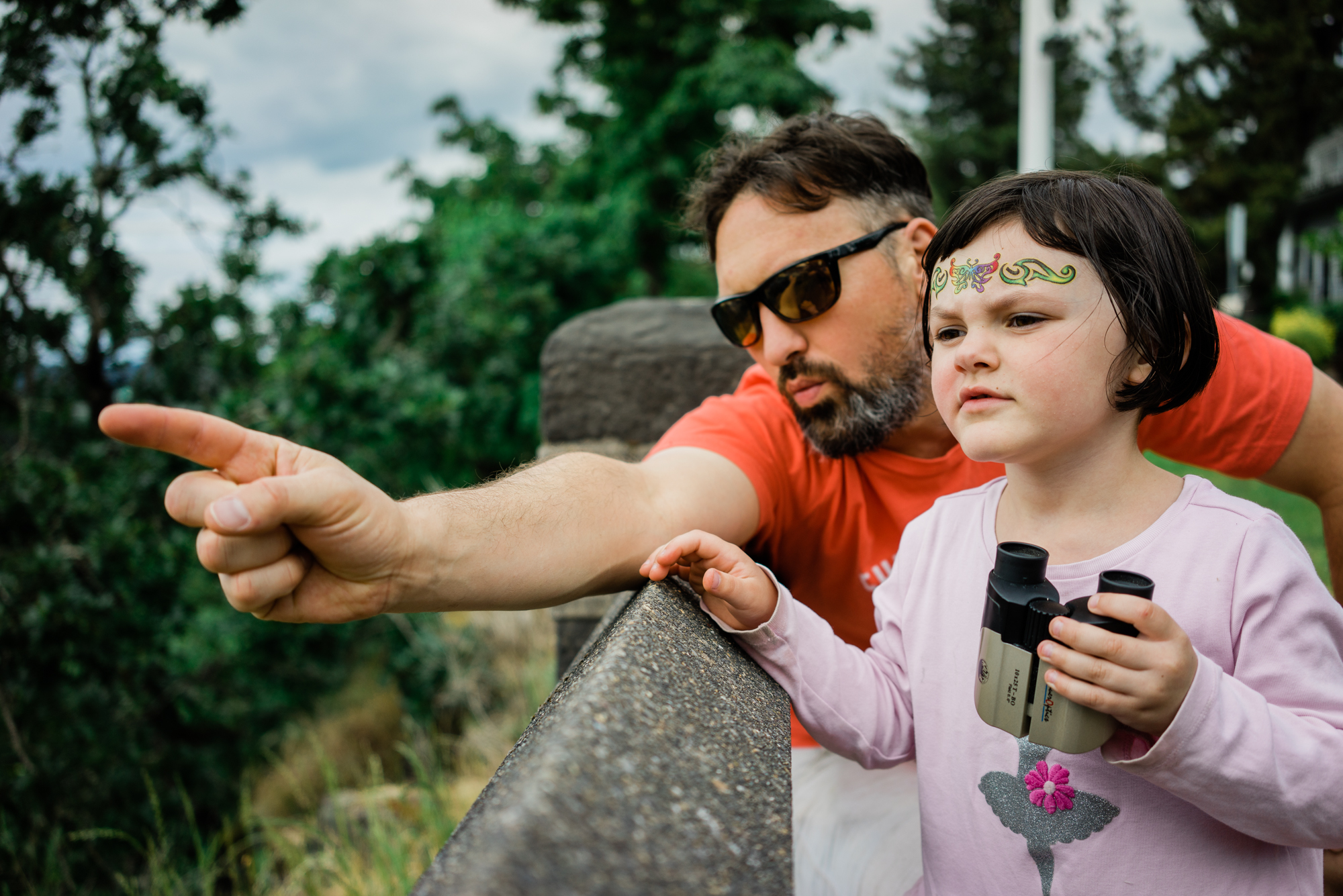 father points out something in the distance - Documentary Family Photography