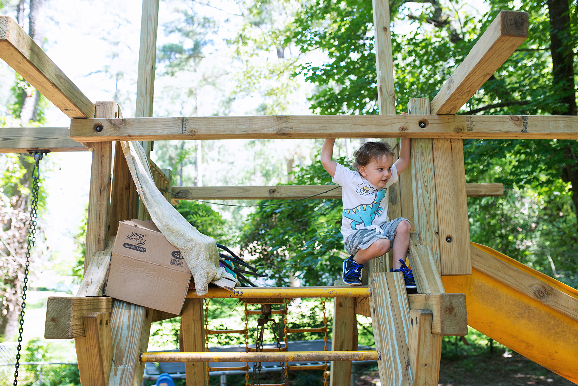 boy playing in fort - documentary family photography