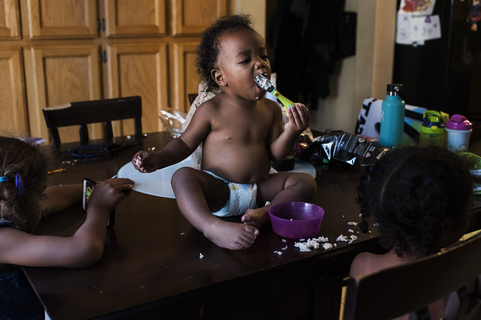 boy eating on table - documentary family photography