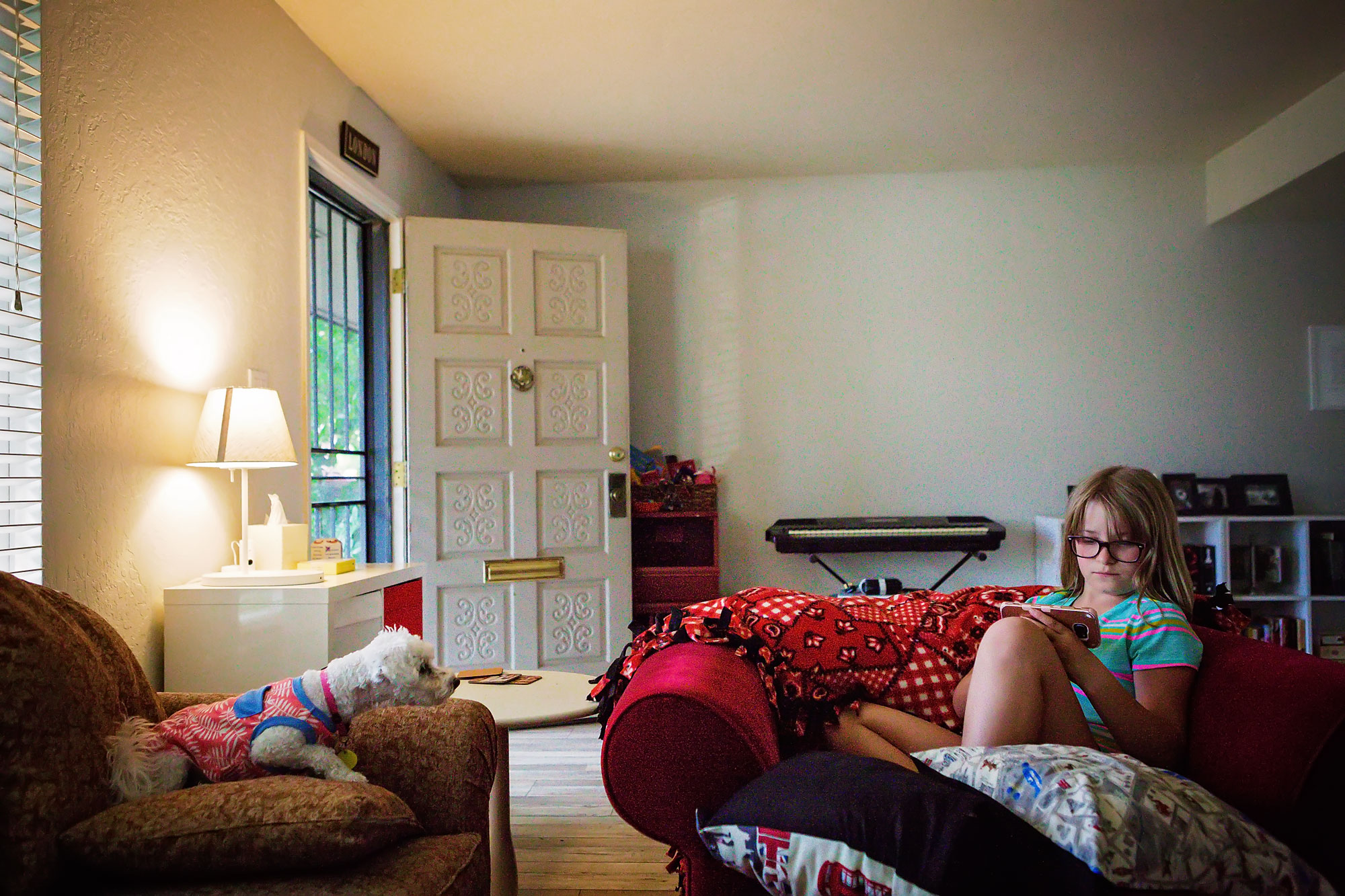 girl reading on couch - documentary family photography