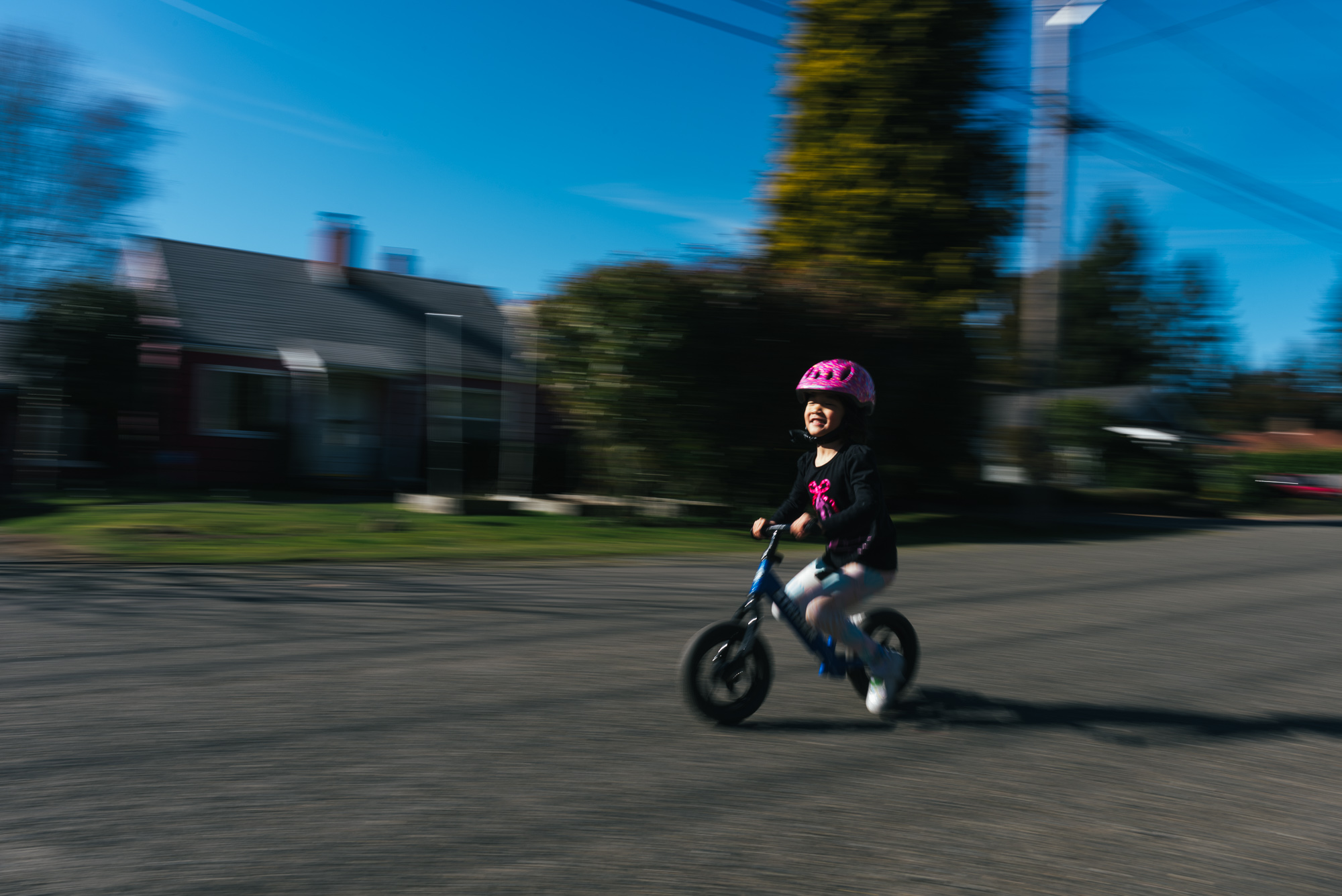 child on balance bike -documentary family photography