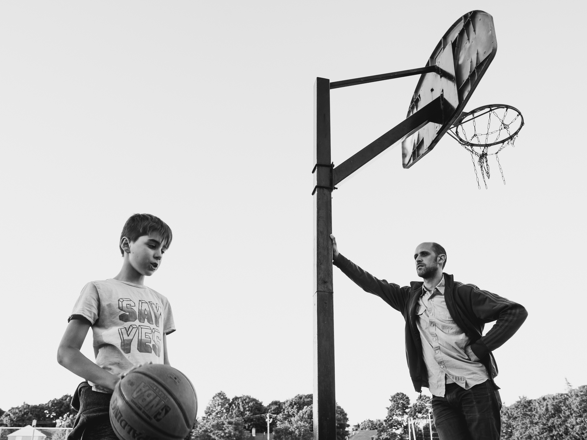 father and son on basketball court - documentary family photography