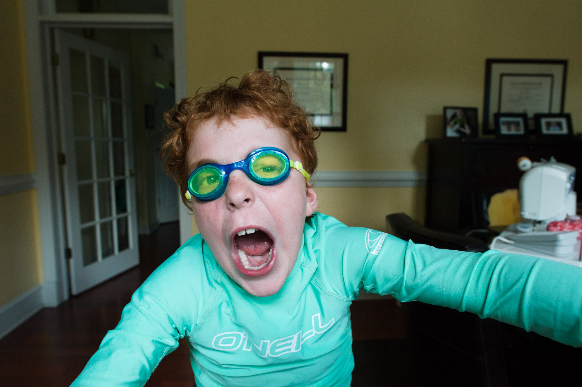 boy yelling in goggles - documentary family photography