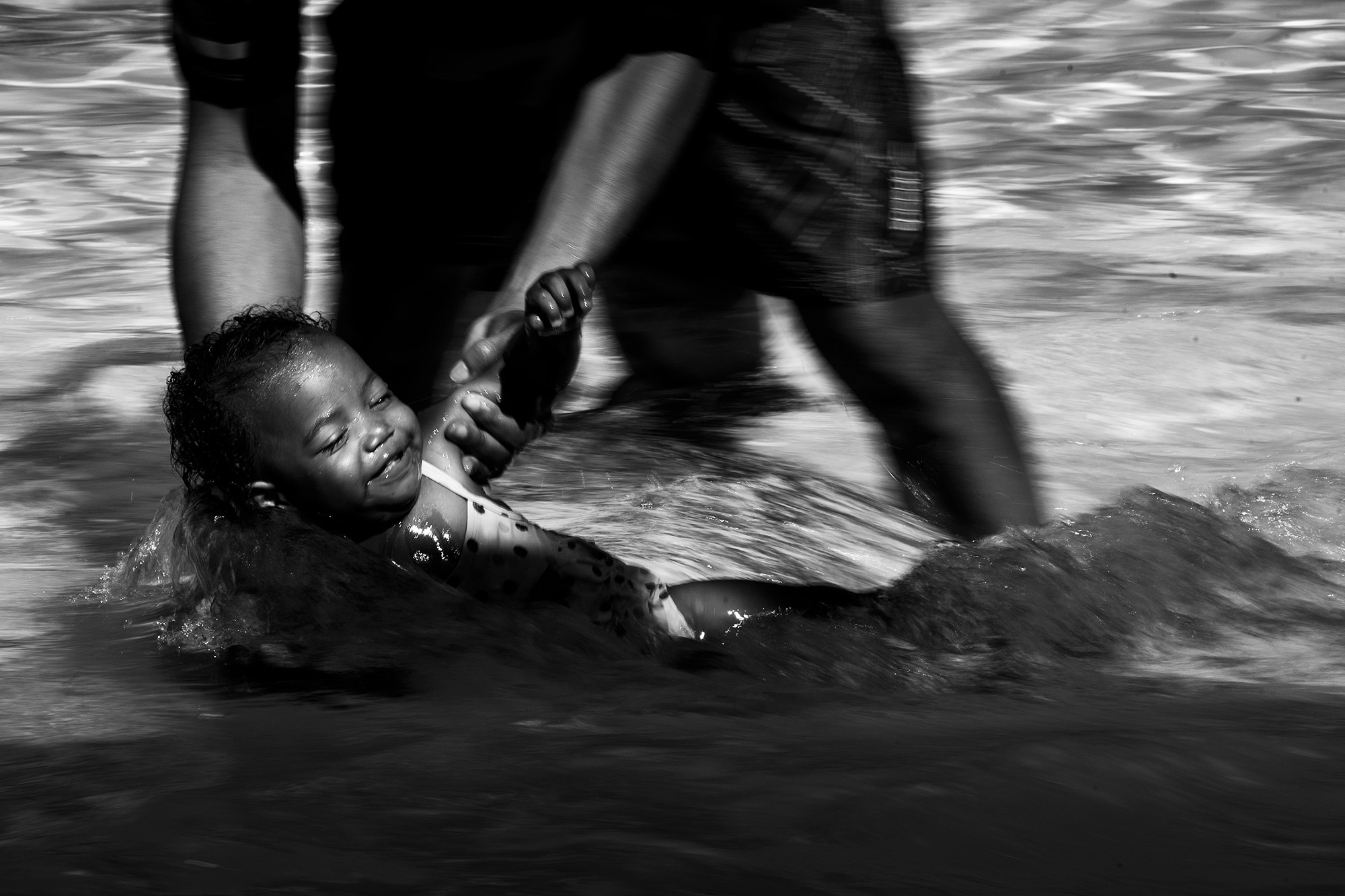 toddler in water - documentary family photography