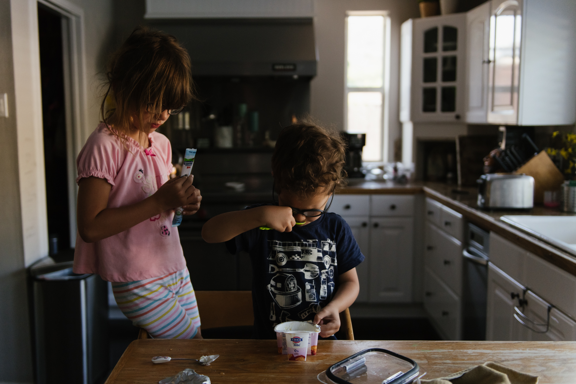 kids playing in kitchen - documentary family photography