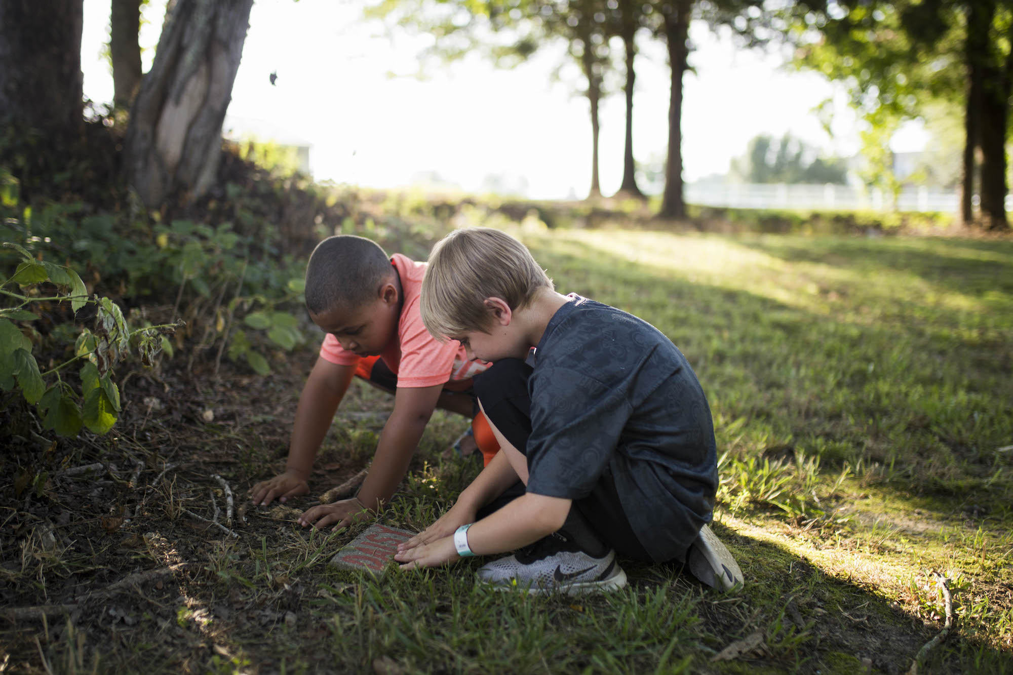 boys at pet grave marker - documentary family photography