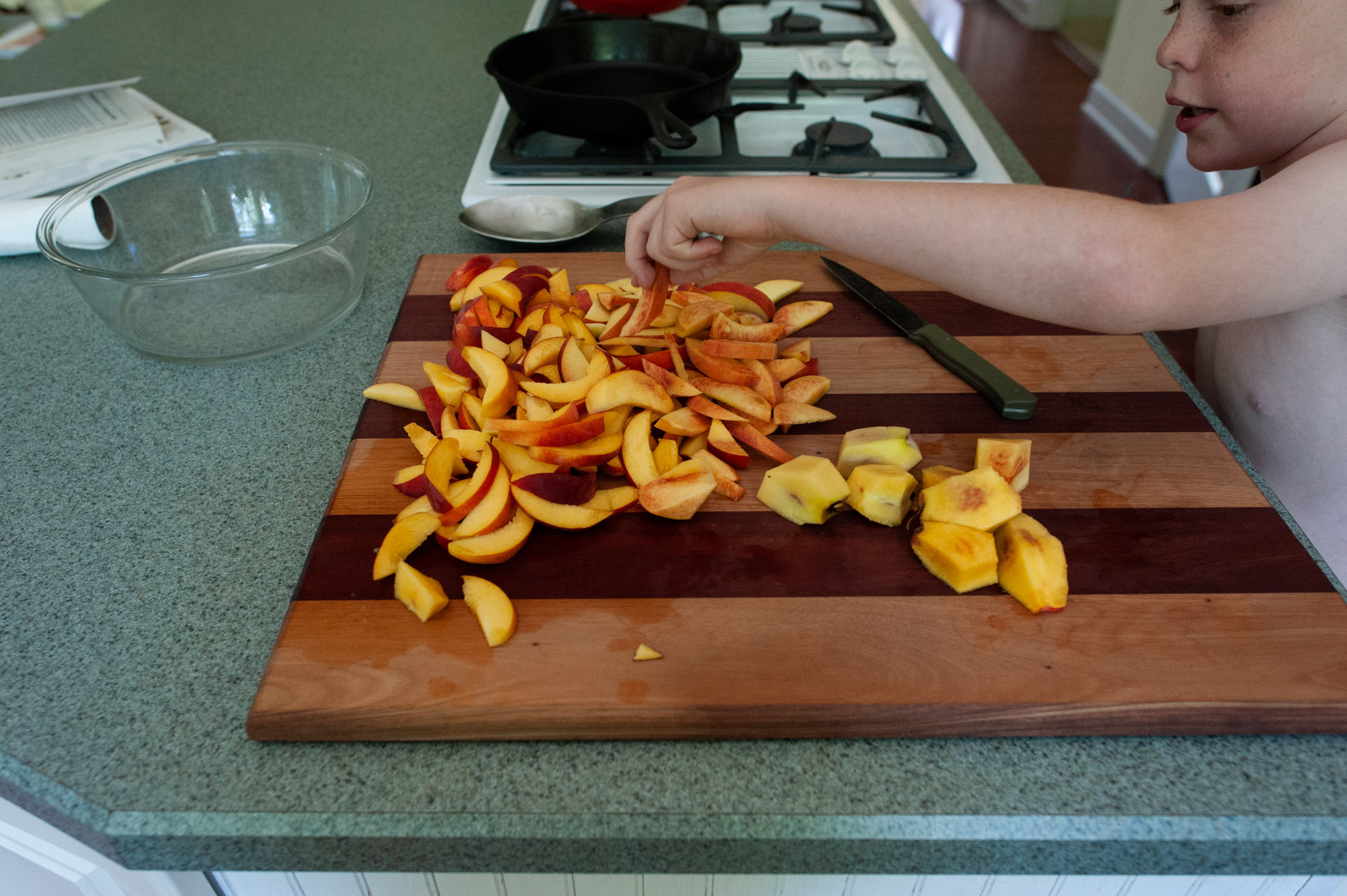 boy with peach slices - documentary family photography