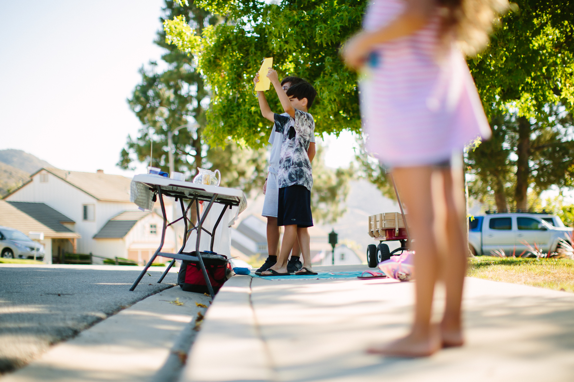 kids with lemonade stand - documentary family photography