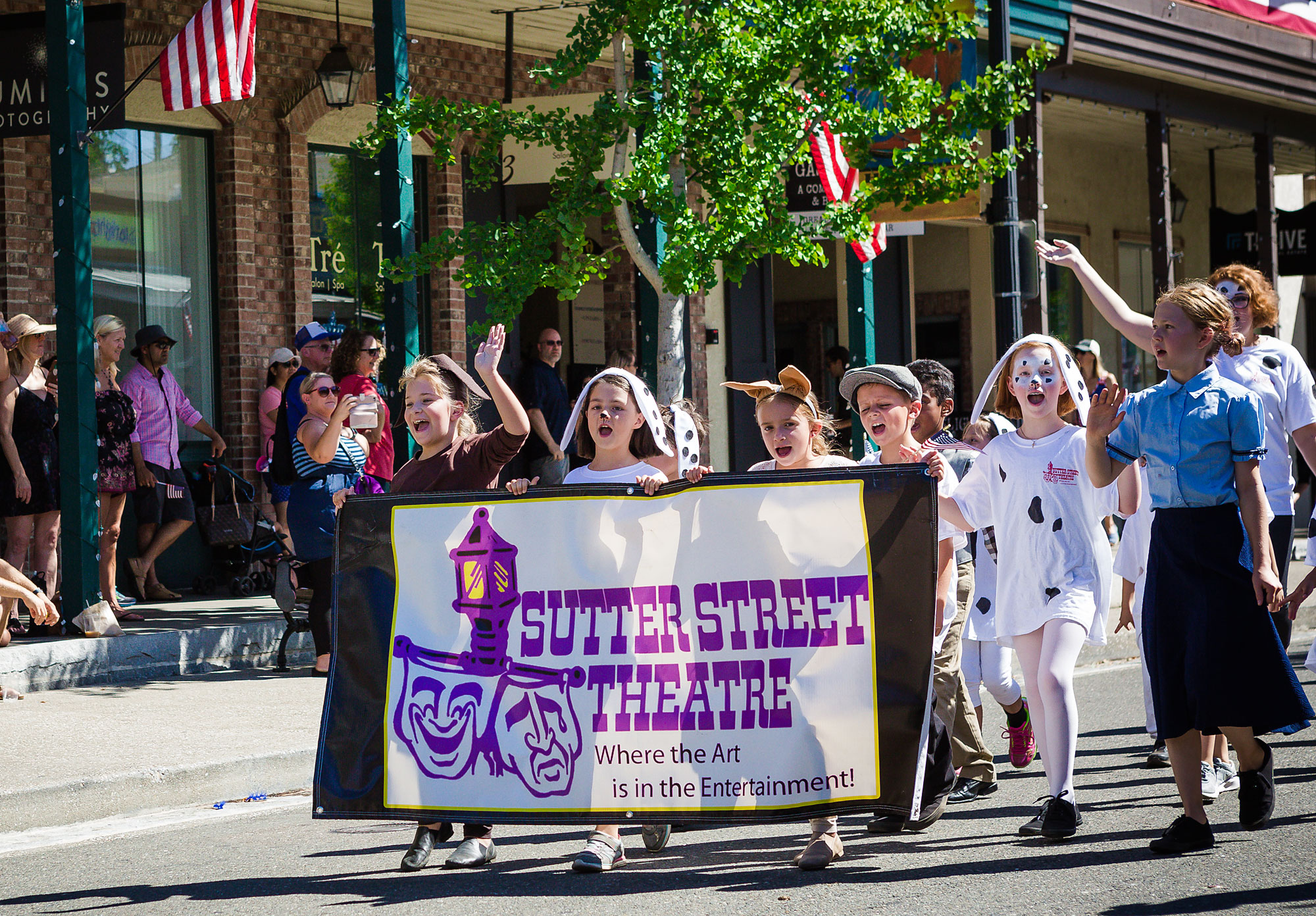 kids march in parade - Documentary Family Photography