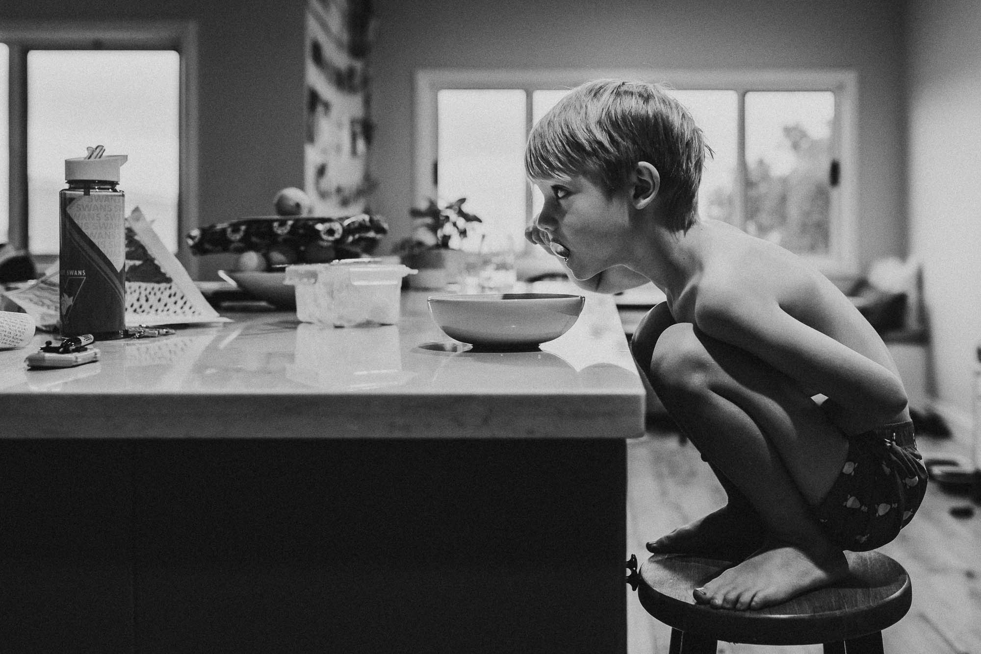 boy eating from bowl - Documentary Family Photography