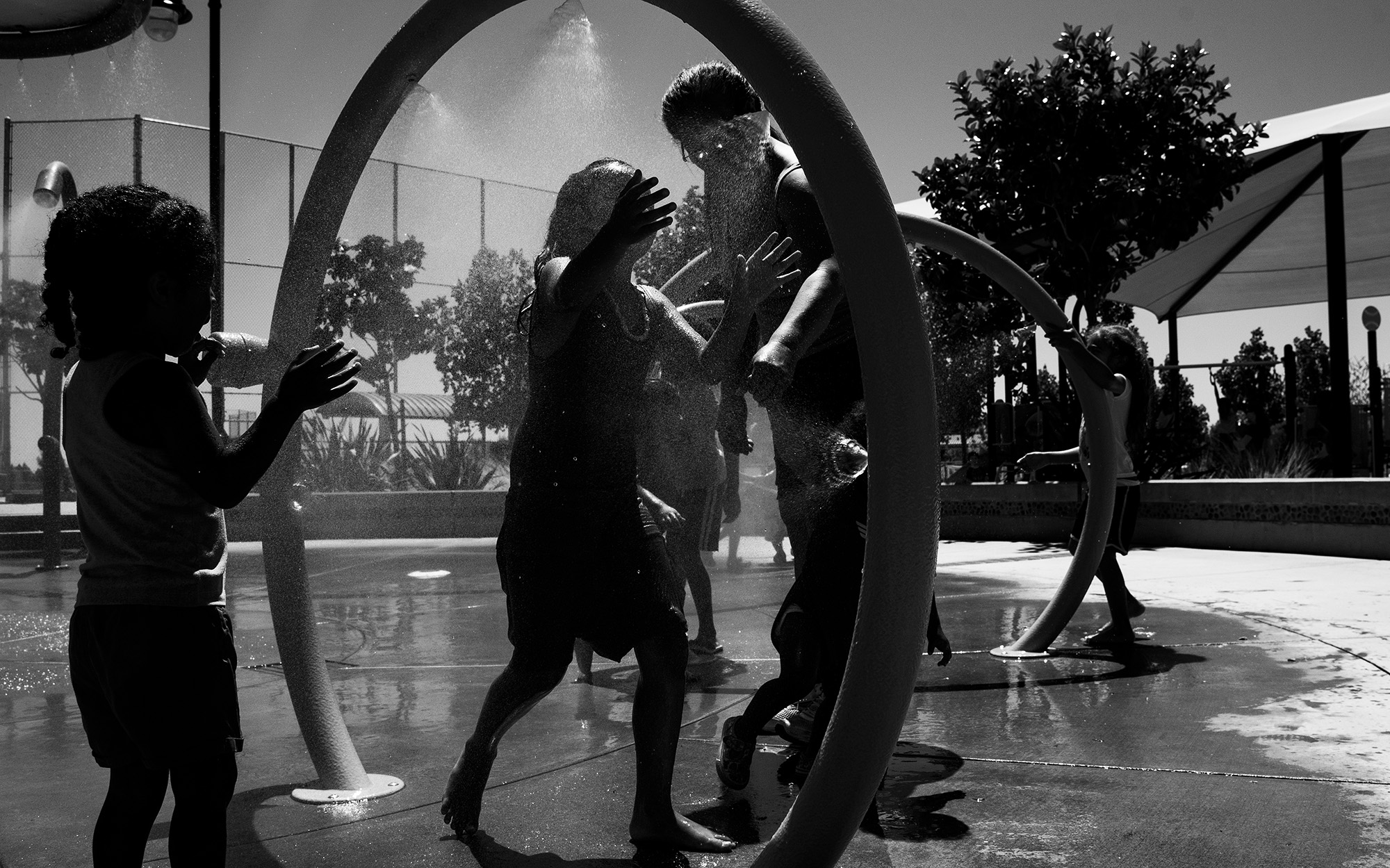 kids at splash pad - documentary family photography