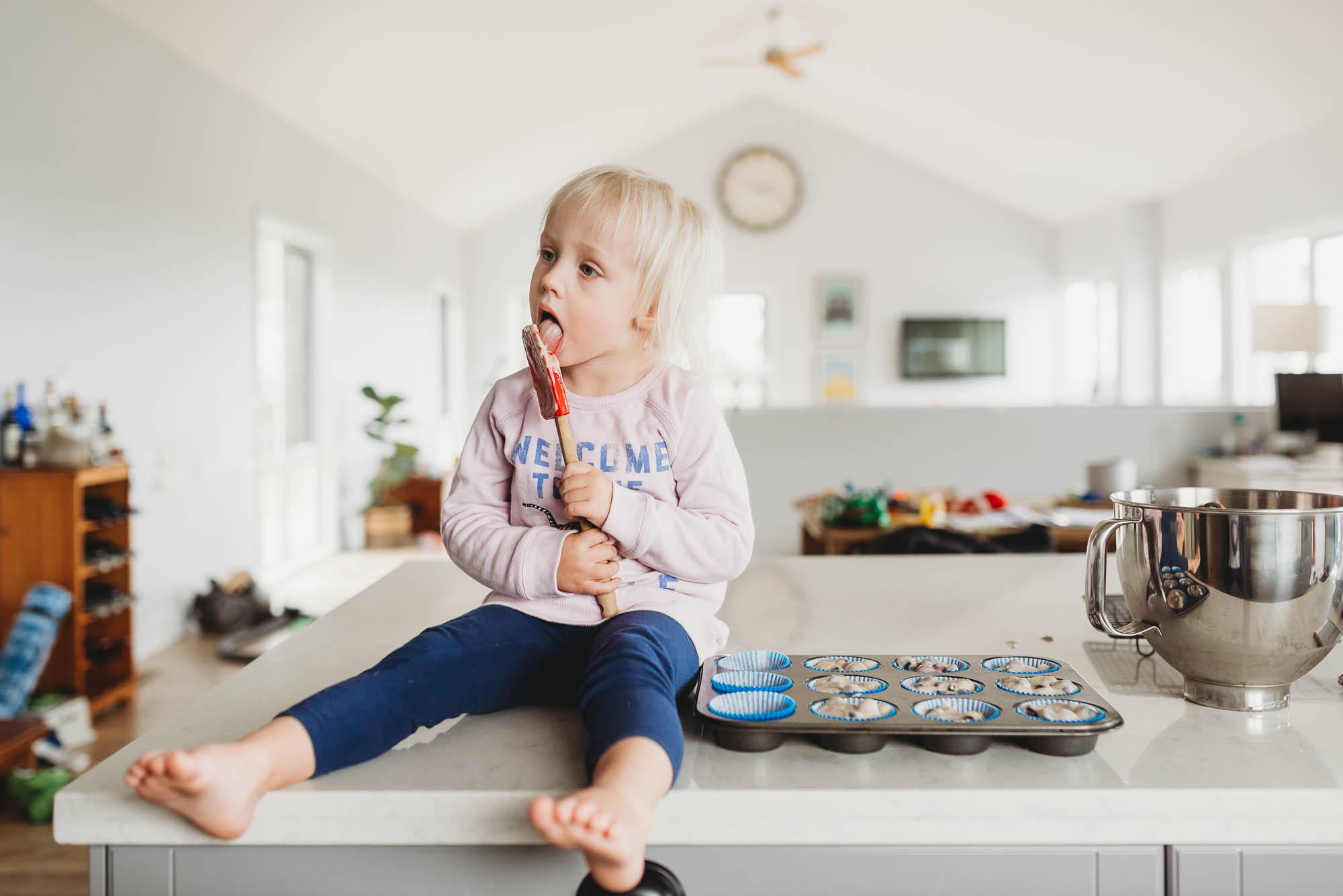 girl licking spatula - documentary family photography