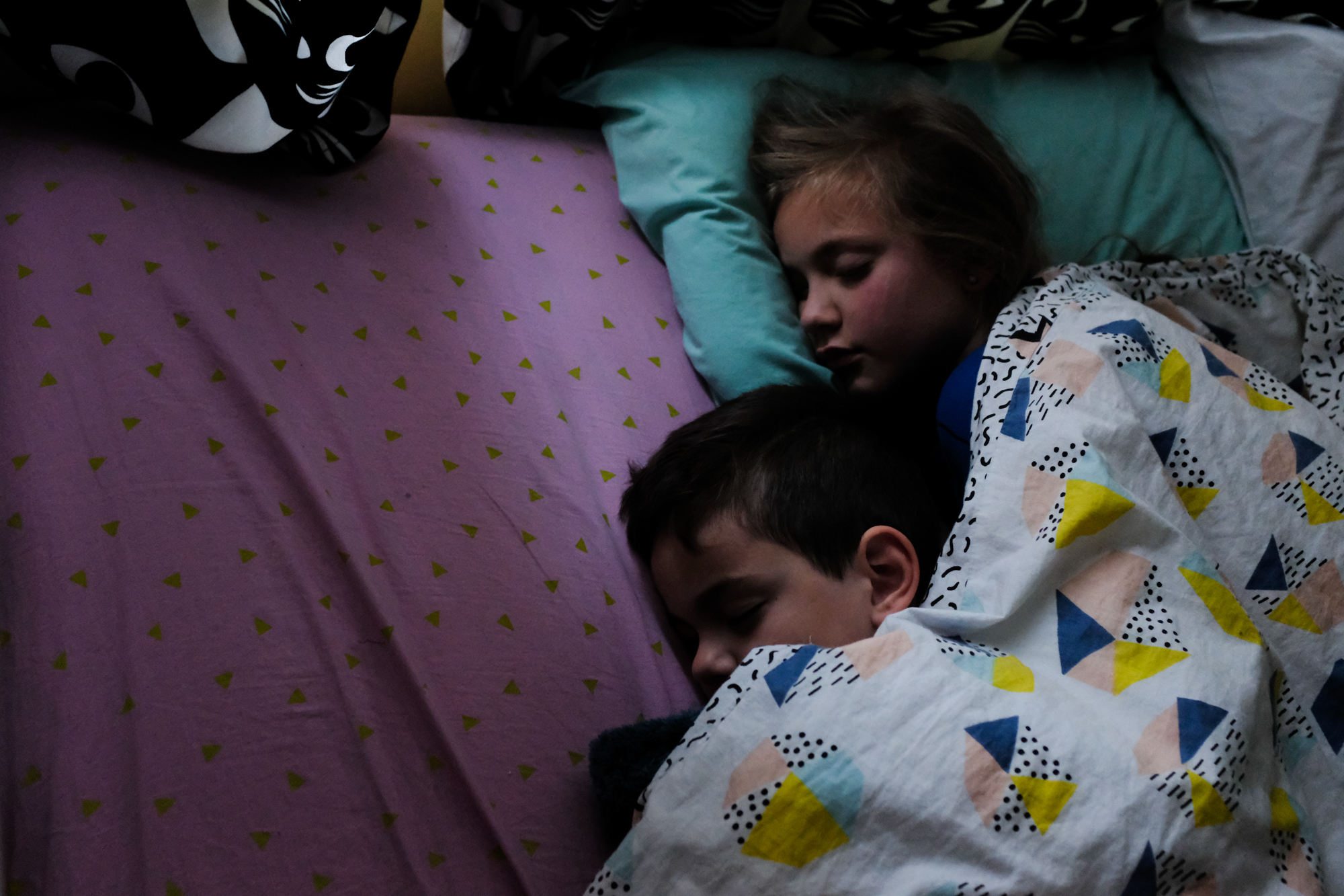 kids sleeping together - documentary family photography