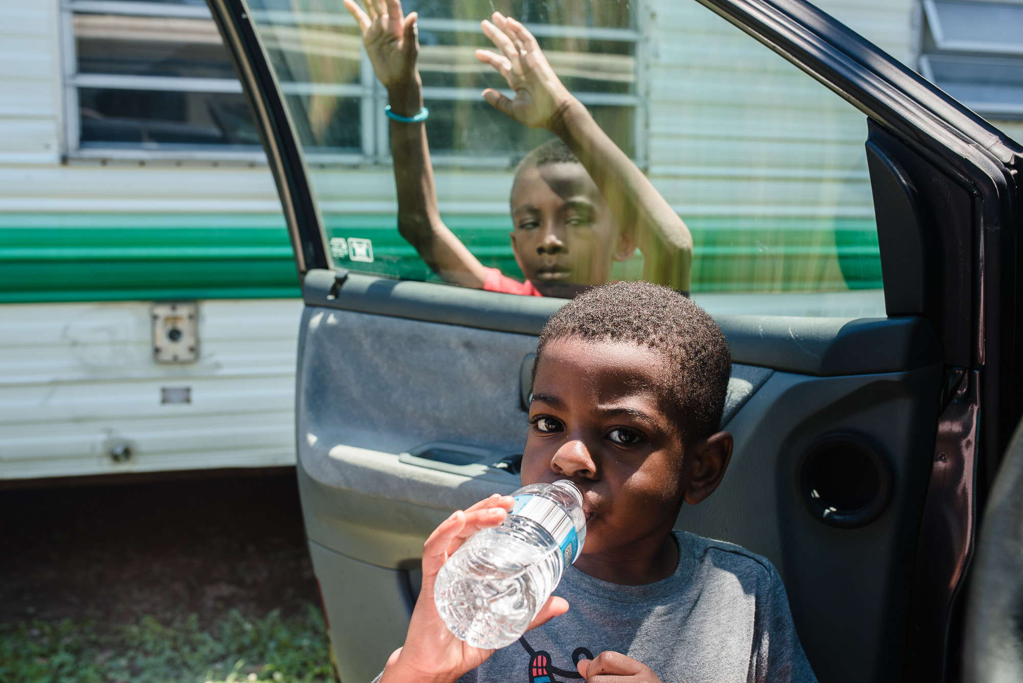 boys on bus - documentary family photography