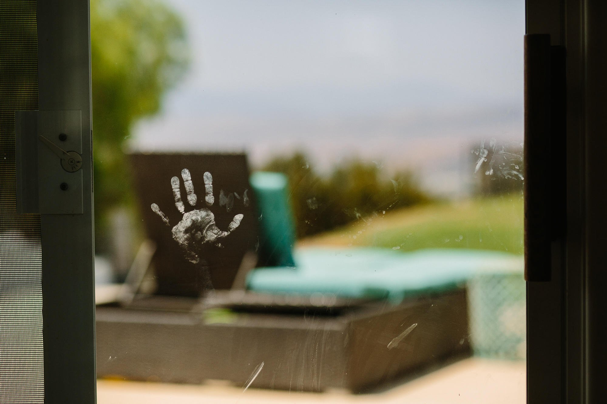 handprint on window - documentary family photography