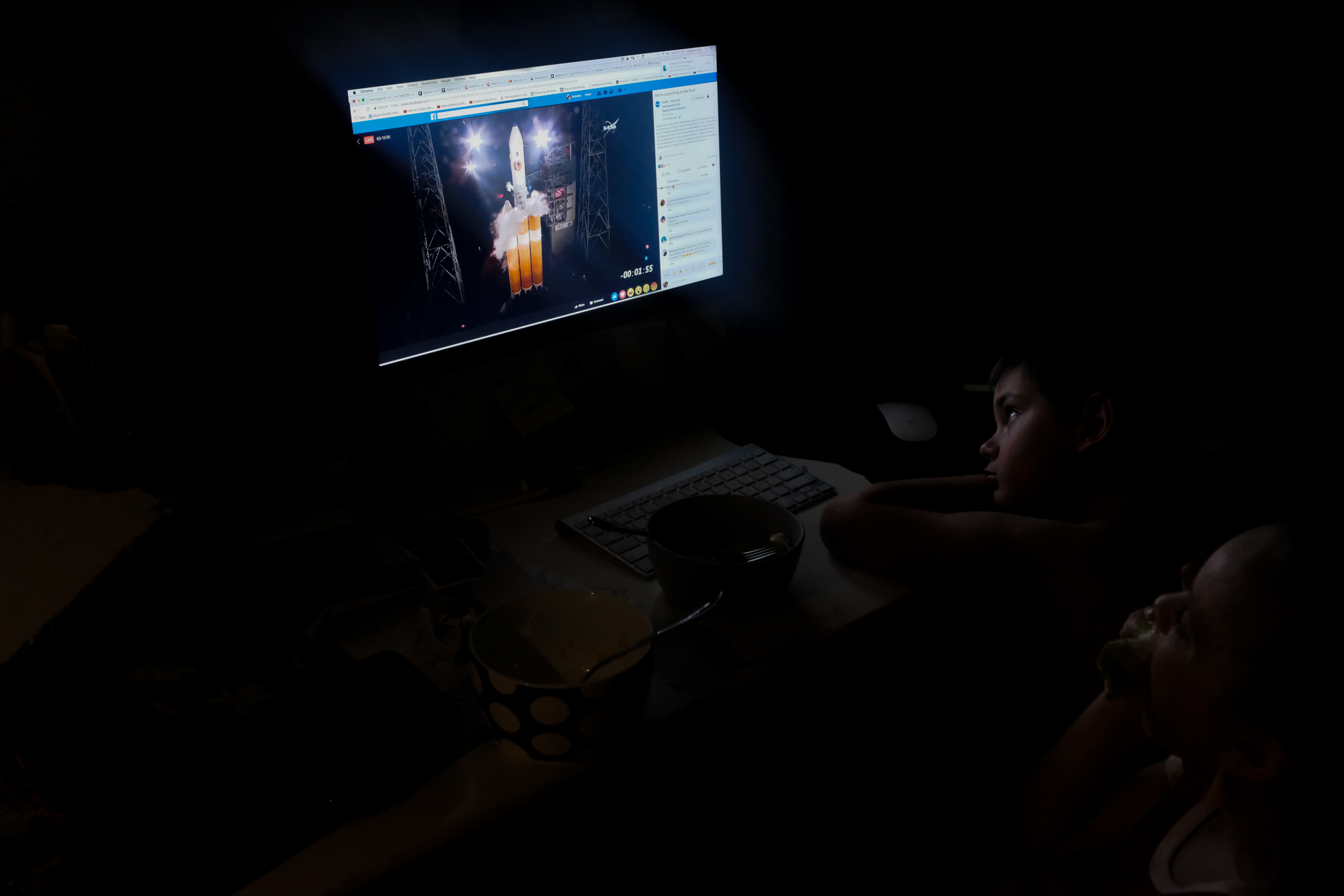 child watching rocket launch - documentary family photography