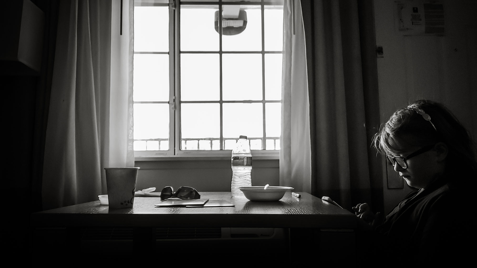 girl at kitchen table - documentary family photography