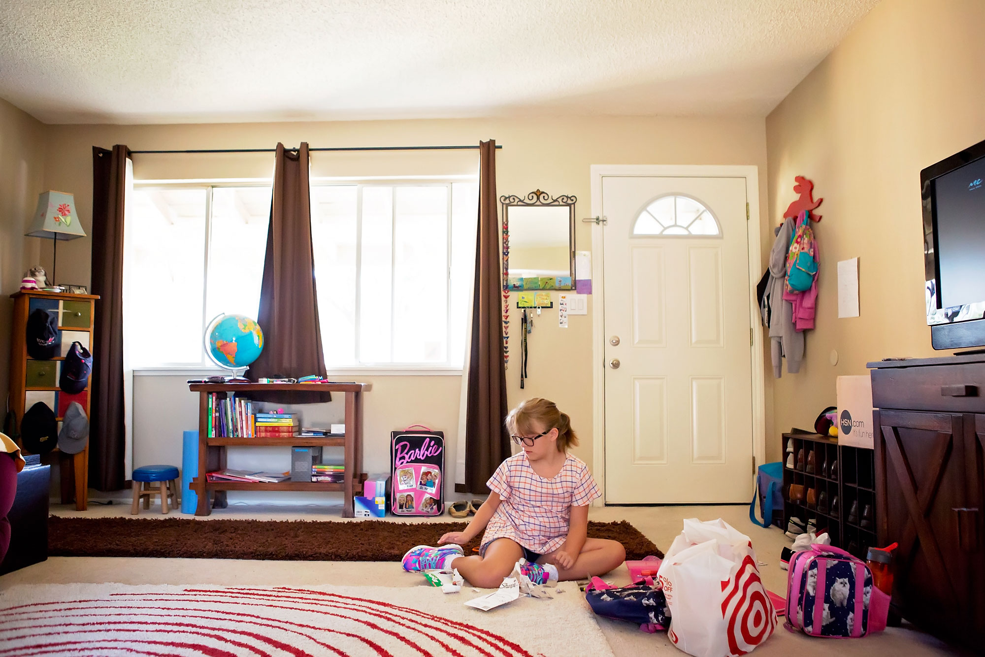 girl with toys on floor - documentary family photography