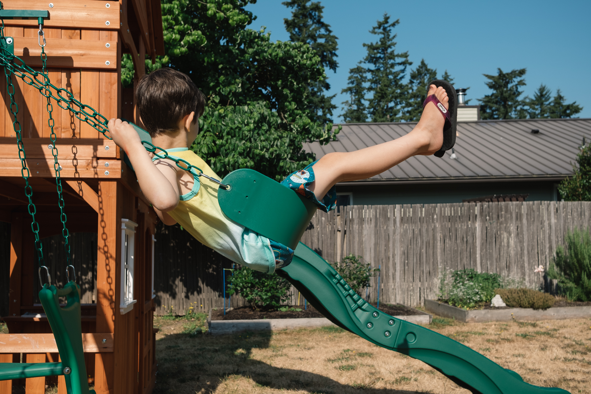 boy on swing - documentary family photography