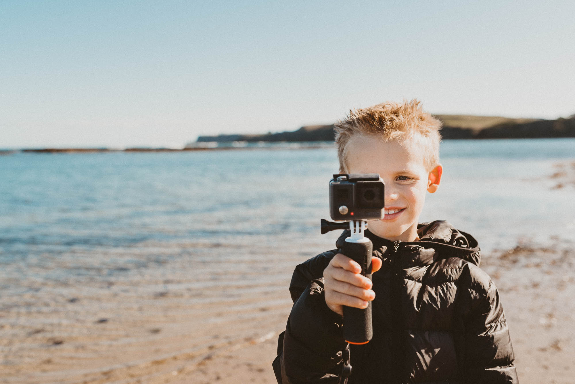 child with GoPro - documentary family photography