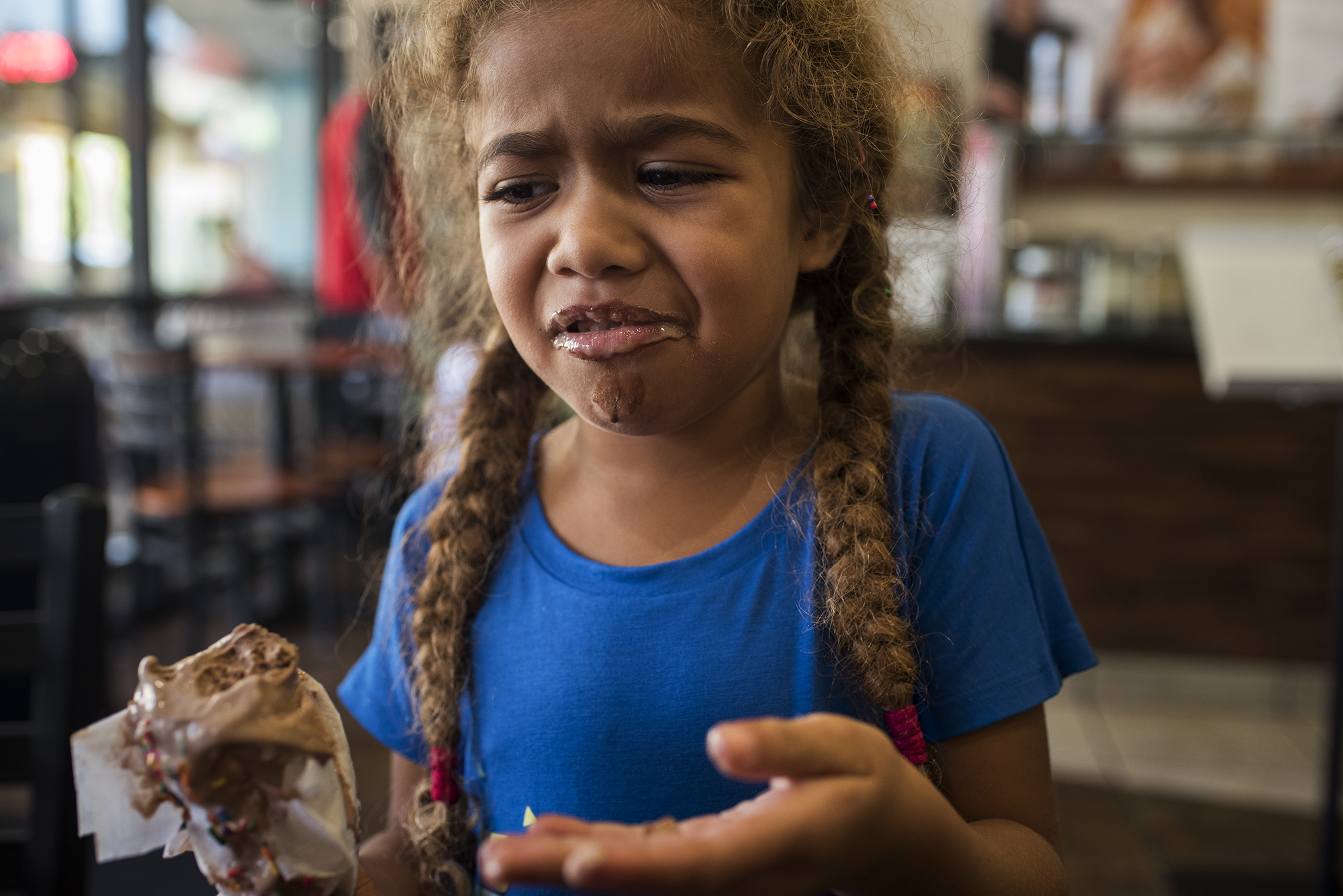 girl making sour face - documentary family photography