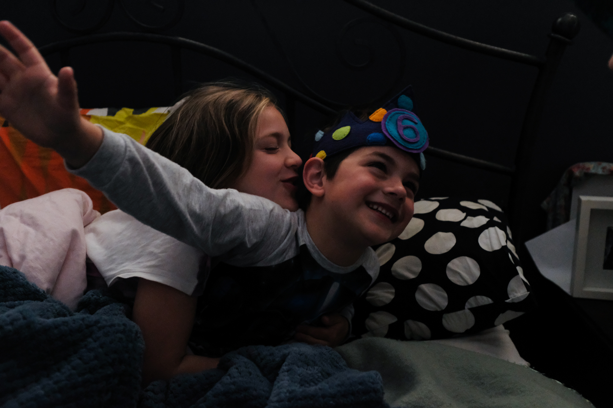 sister hugging brother - documentary family photography