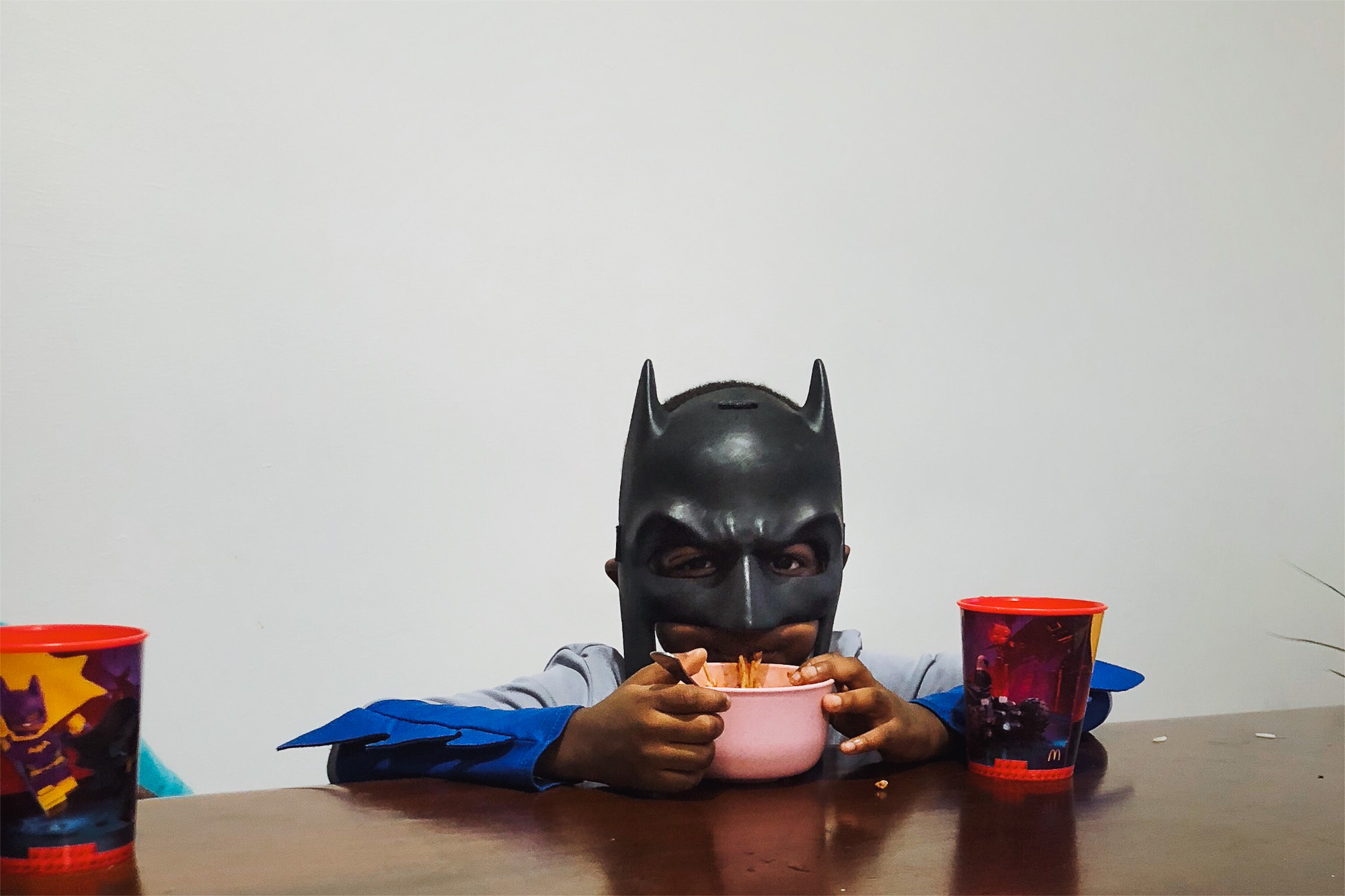 batman eating cereal - documentary family photography