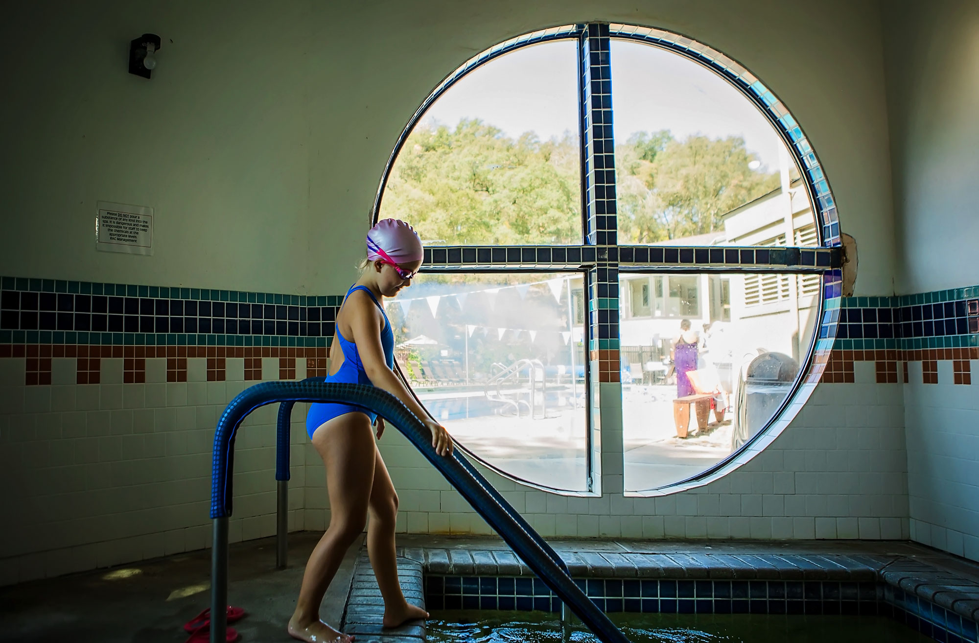 girl entering pool - documentary family photography